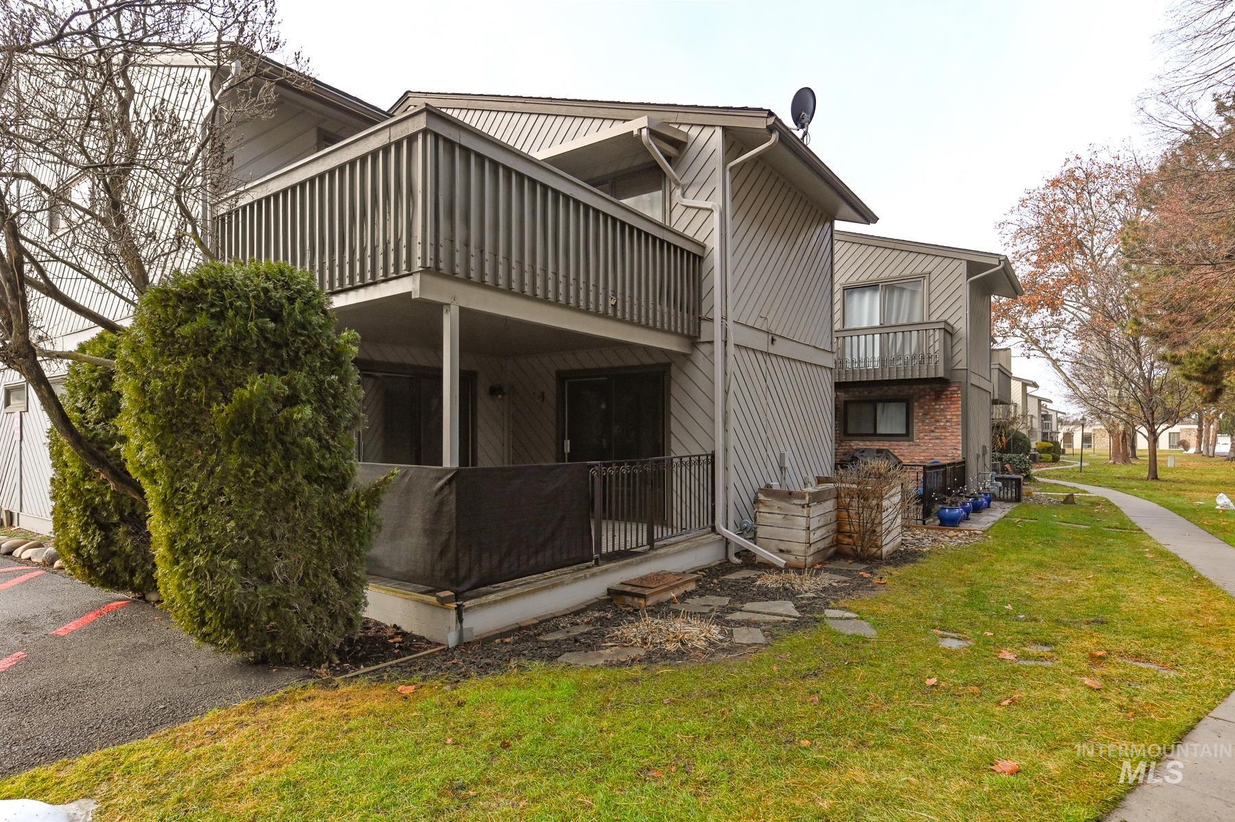 Rear view of property with a lawn