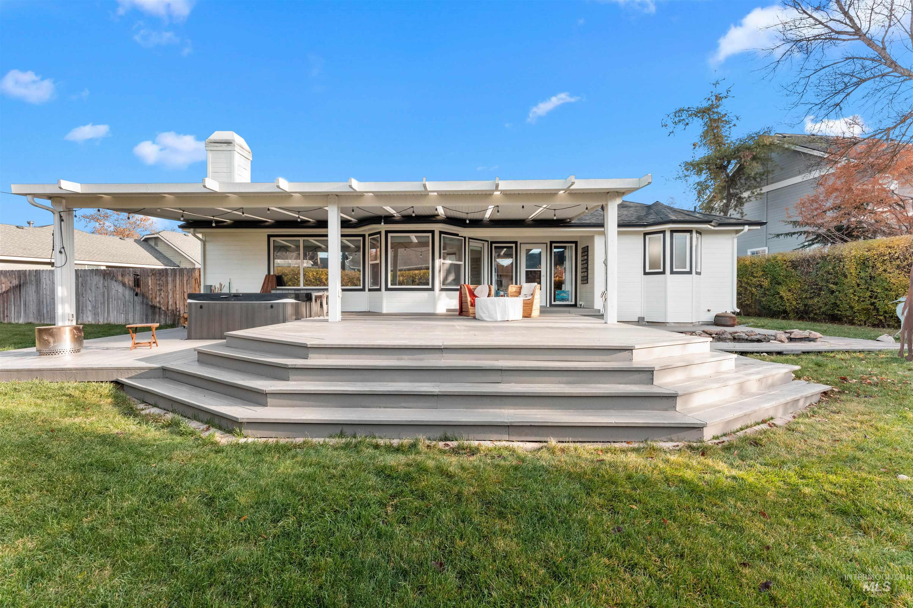 Rear view of property with a patio and a chimney