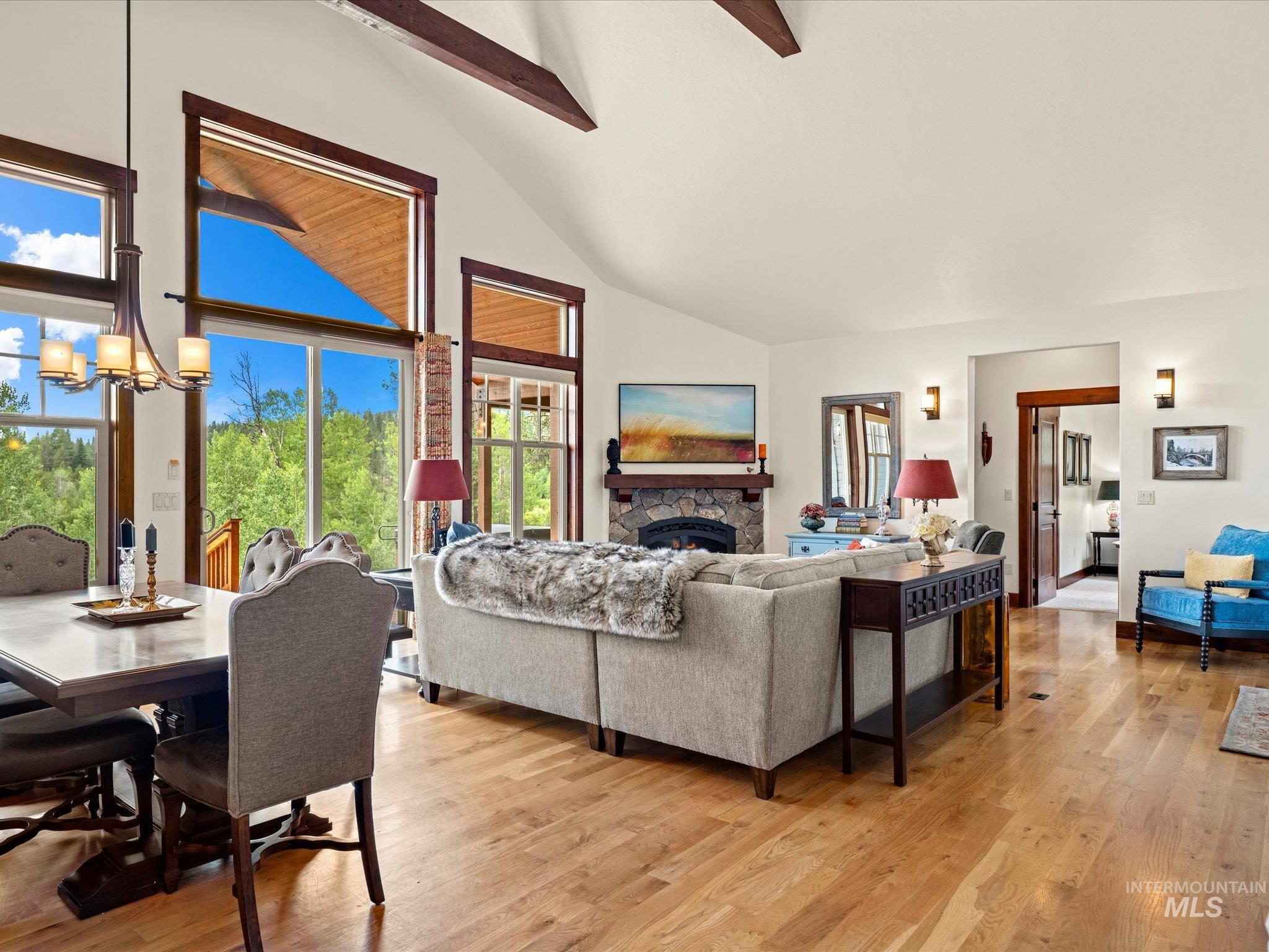 Living Room Features High Ceilings and a propane Fireplace.