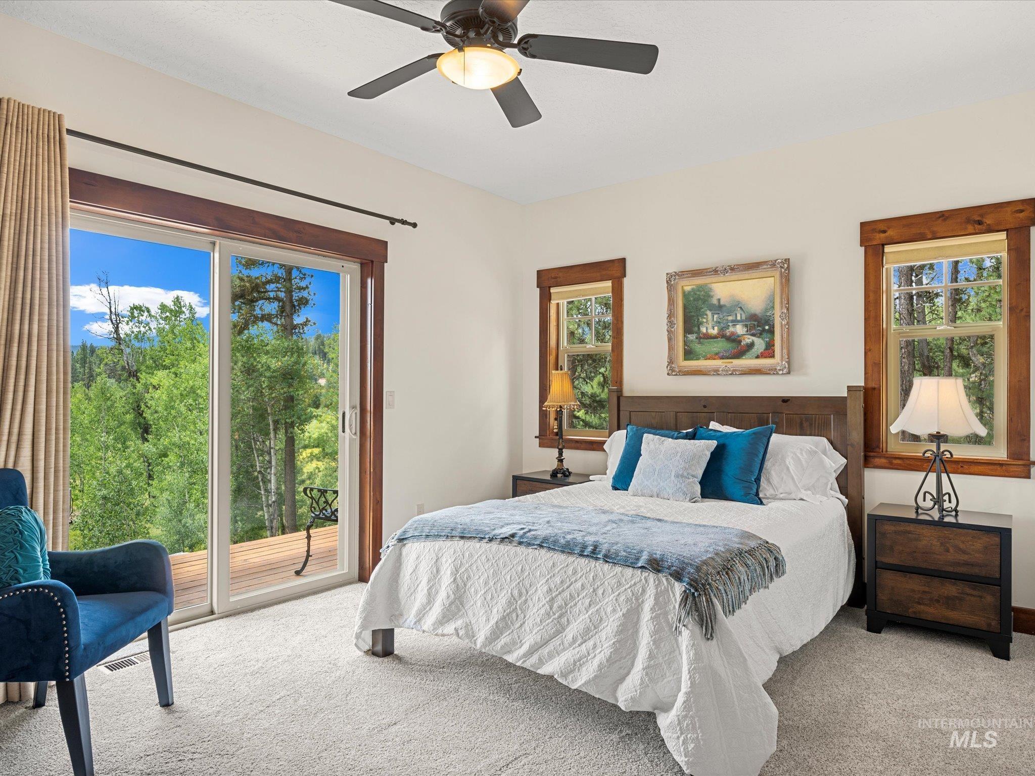 Bedroom 3 has a sliding glass door that opens up onto the deck and has Great Views over the Meadow.