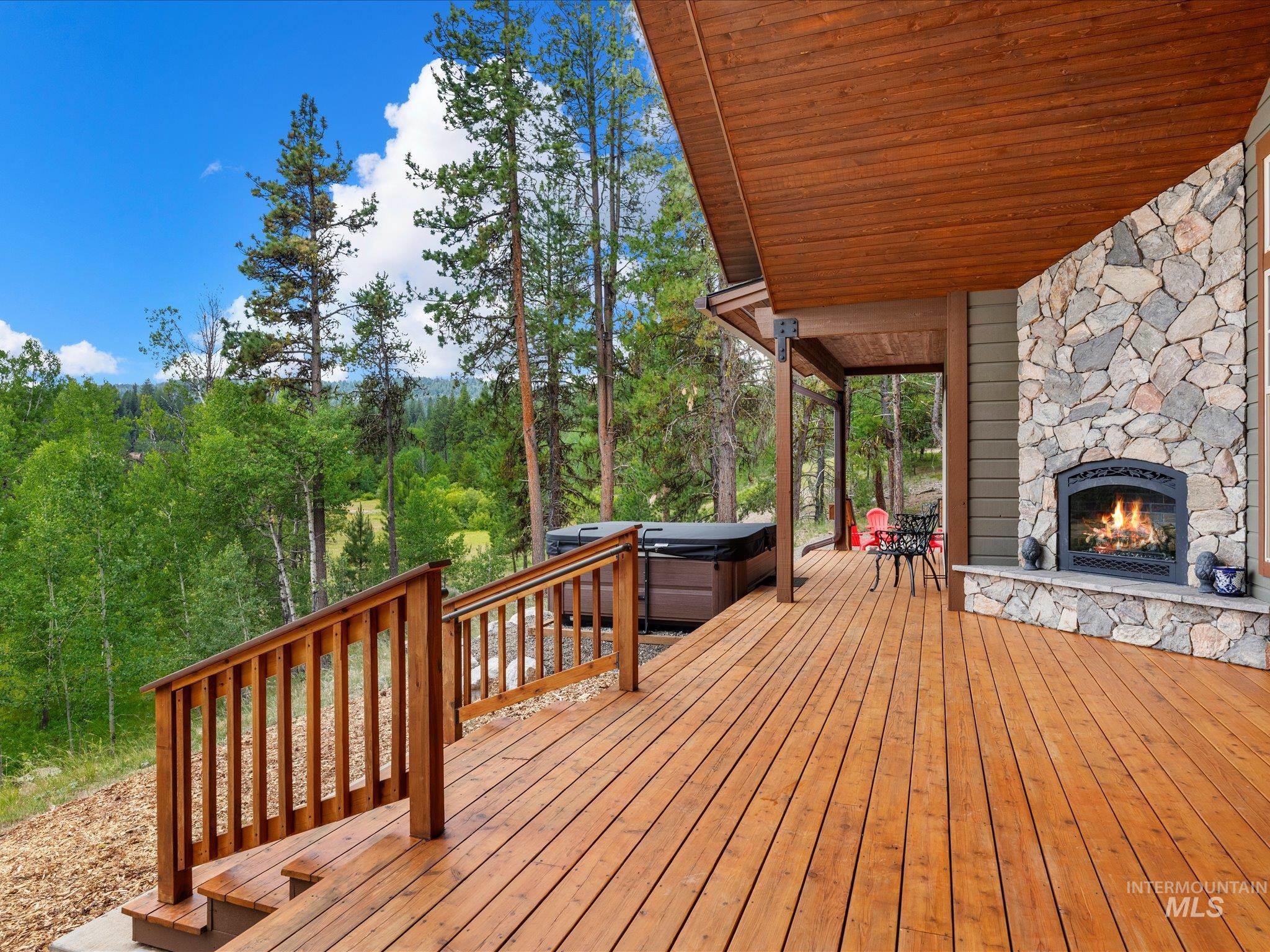 Covered Patio with outdoor Propane Fireplace.