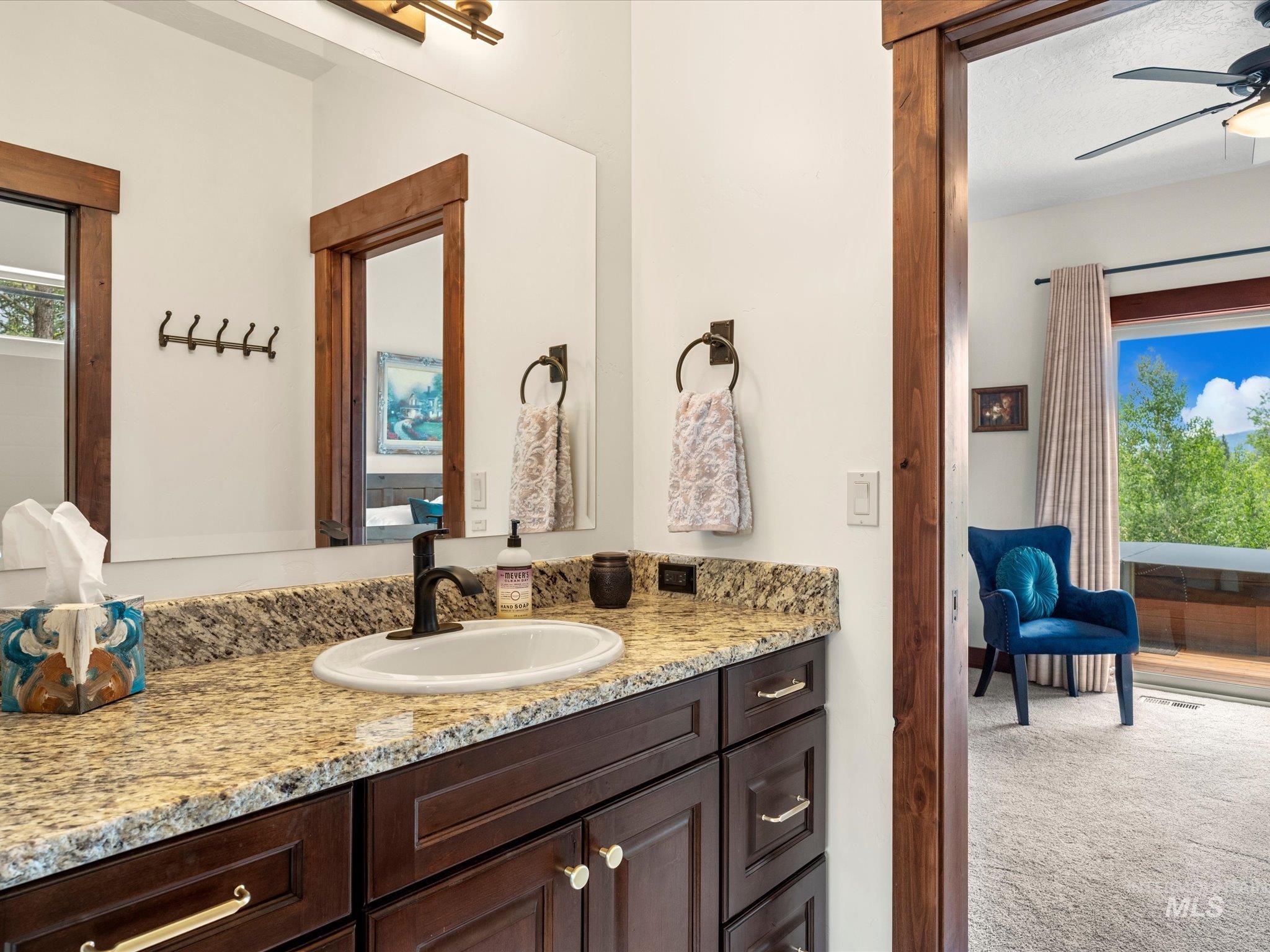 This bathroom is situated between two bedrooms on the Right hand side of the home.