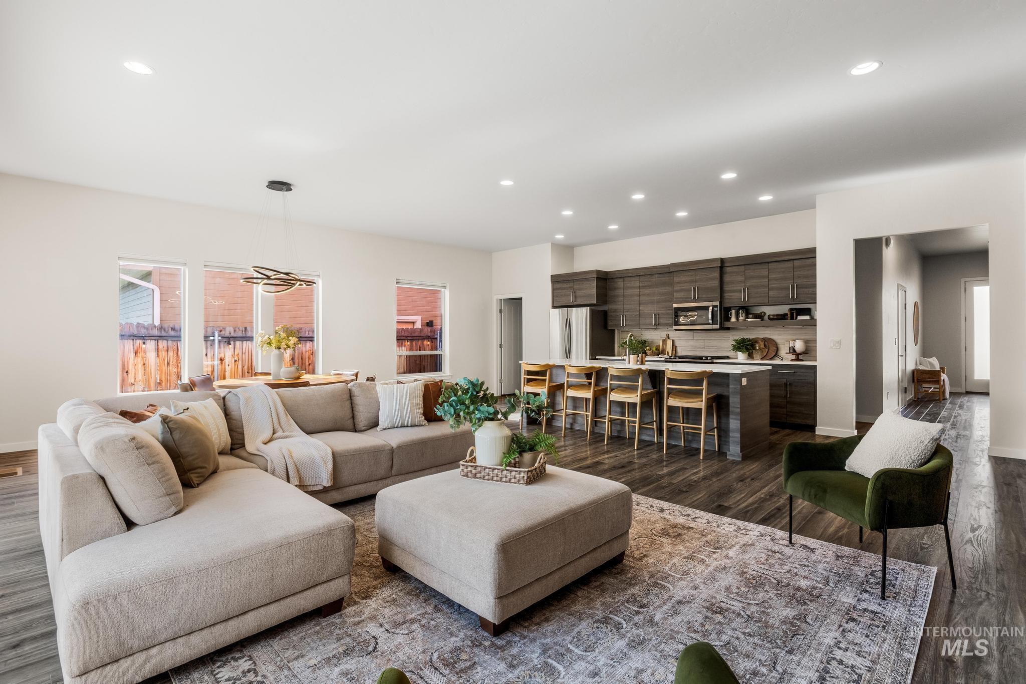 Living room featuring recessed lighting and dark wood finished floors