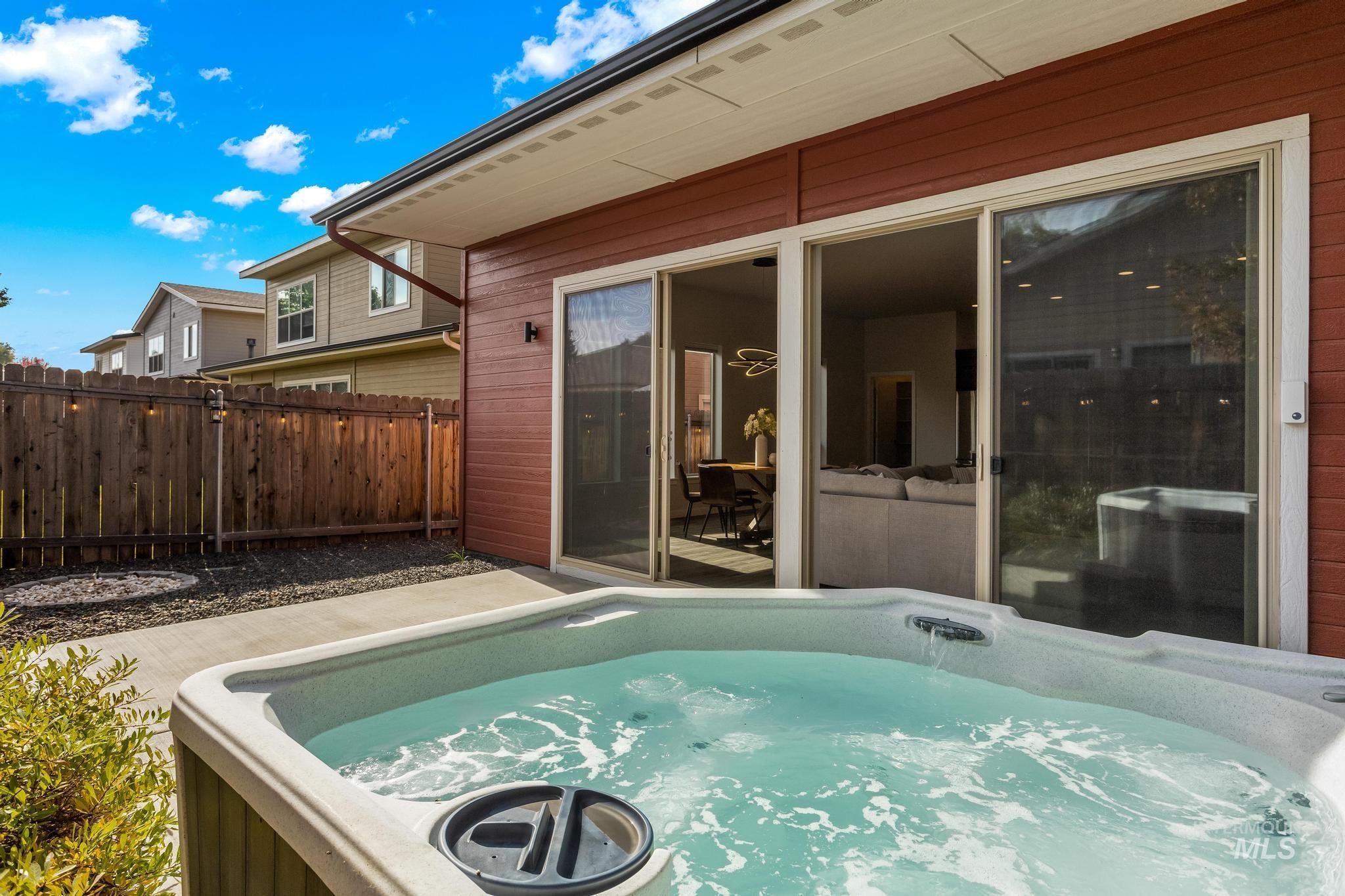 View of patio / terrace with a hot tub