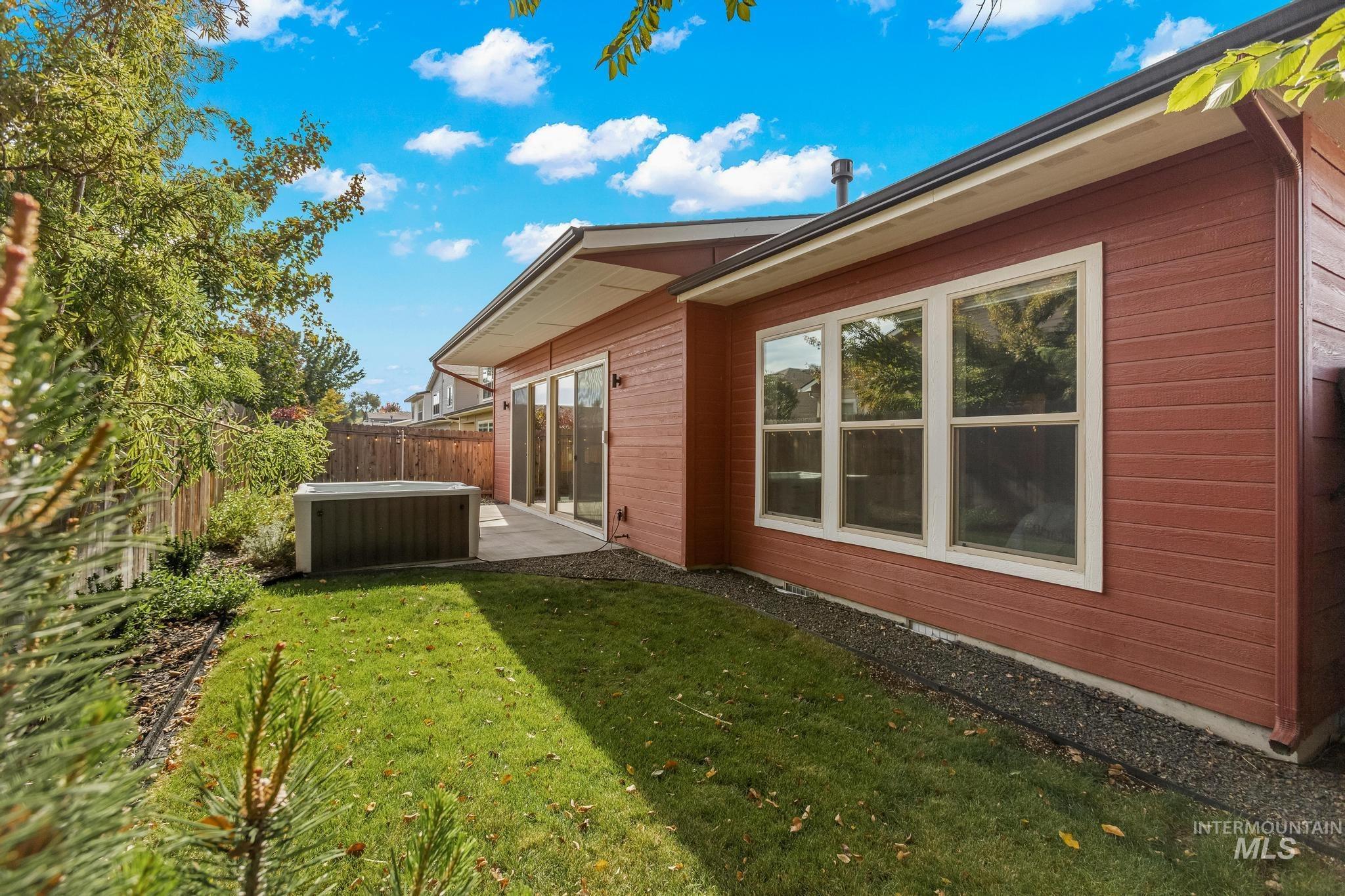 View of side of home featuring a patio area