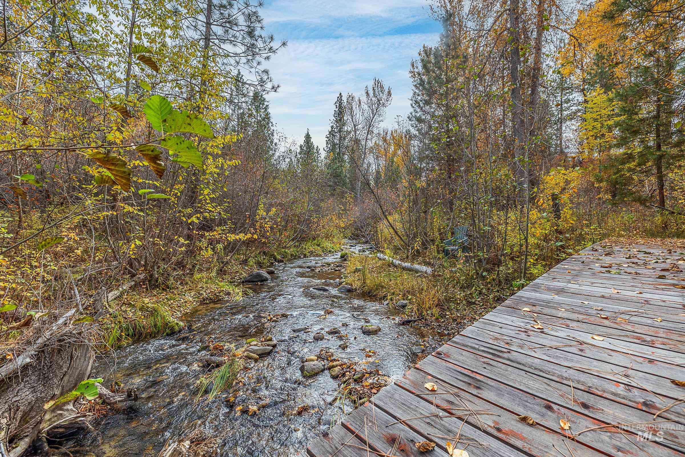 Dock area with a wooded view
