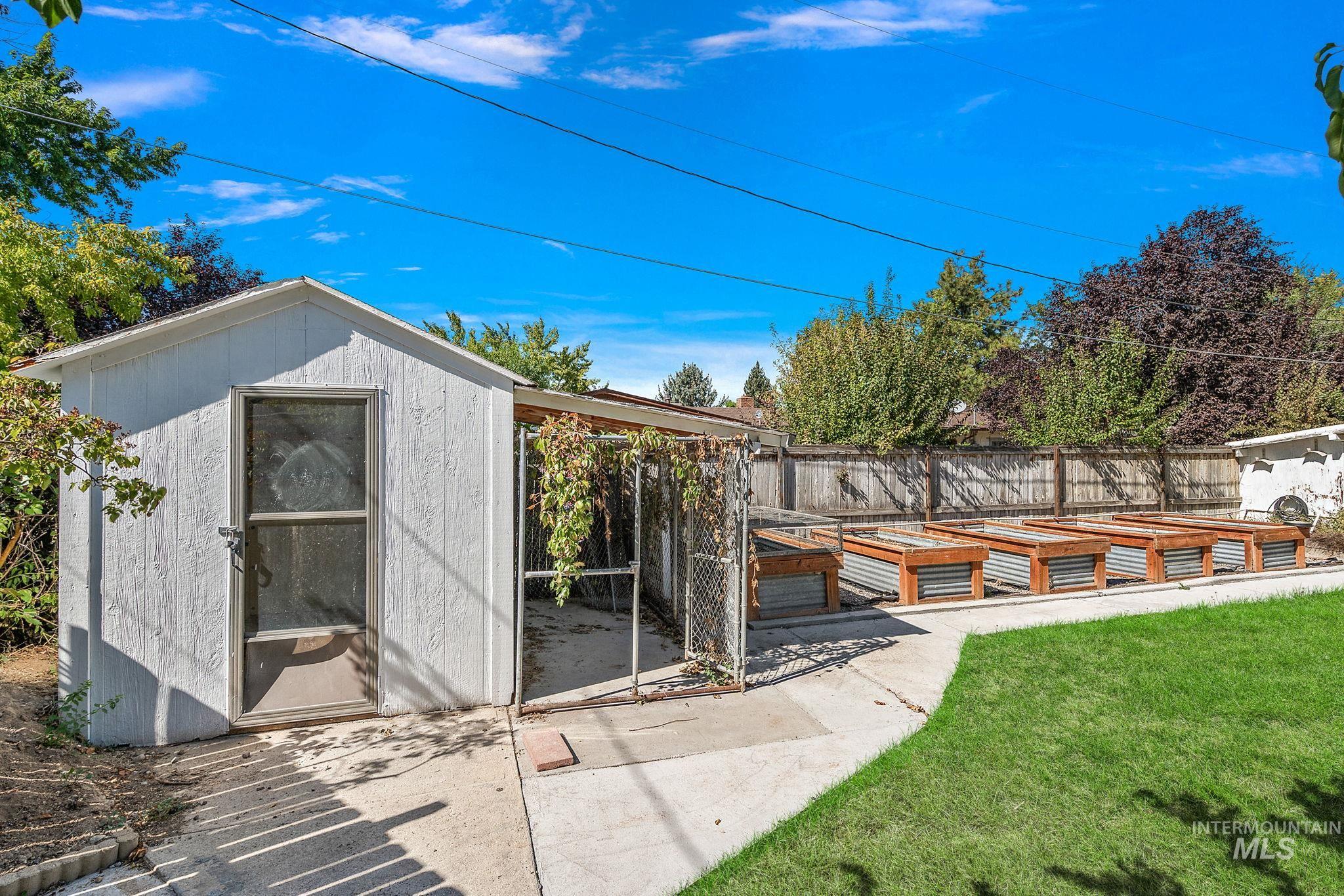 View of shed featuring a vegetable garden