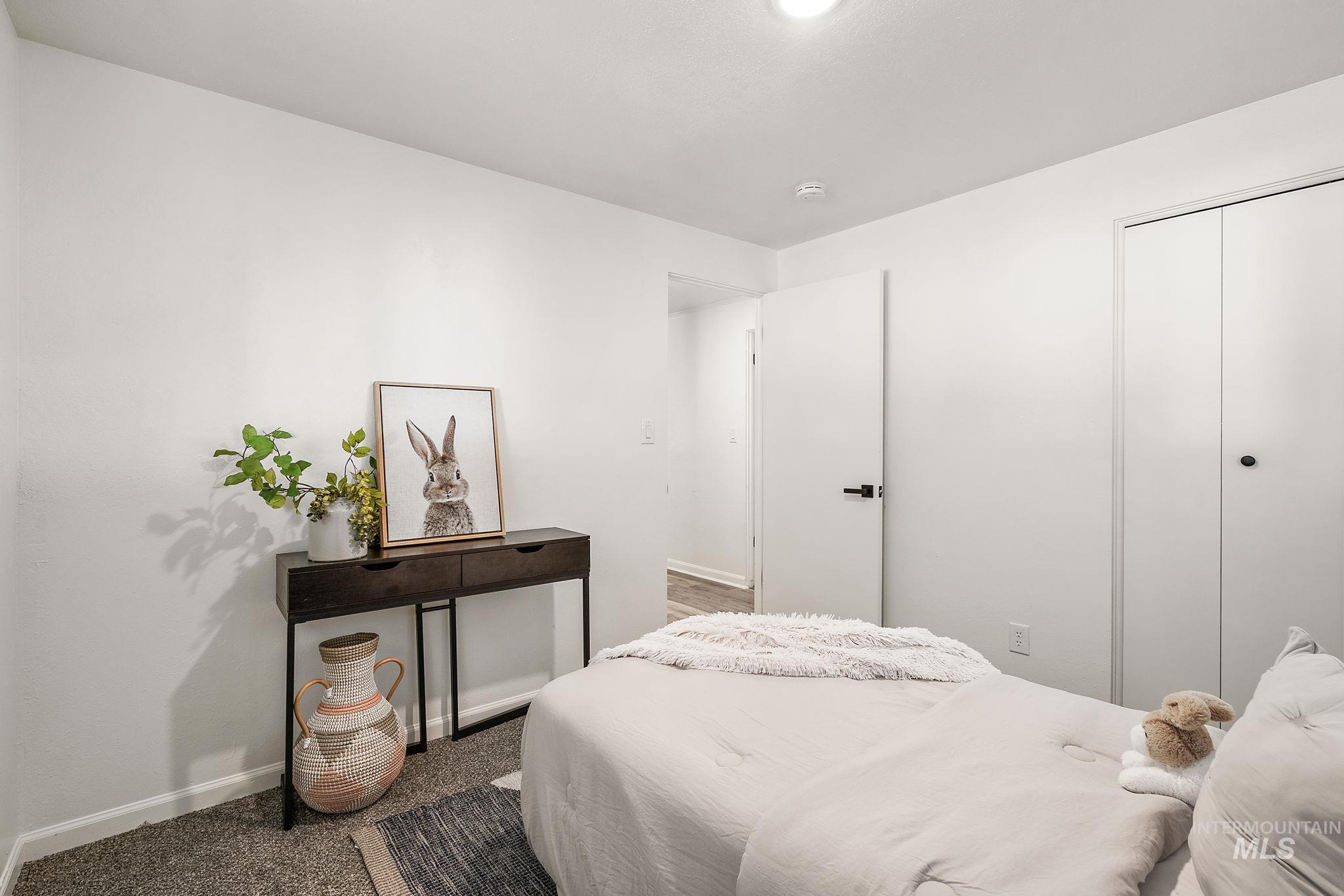 Bedroom featuring a closet and carpet floors