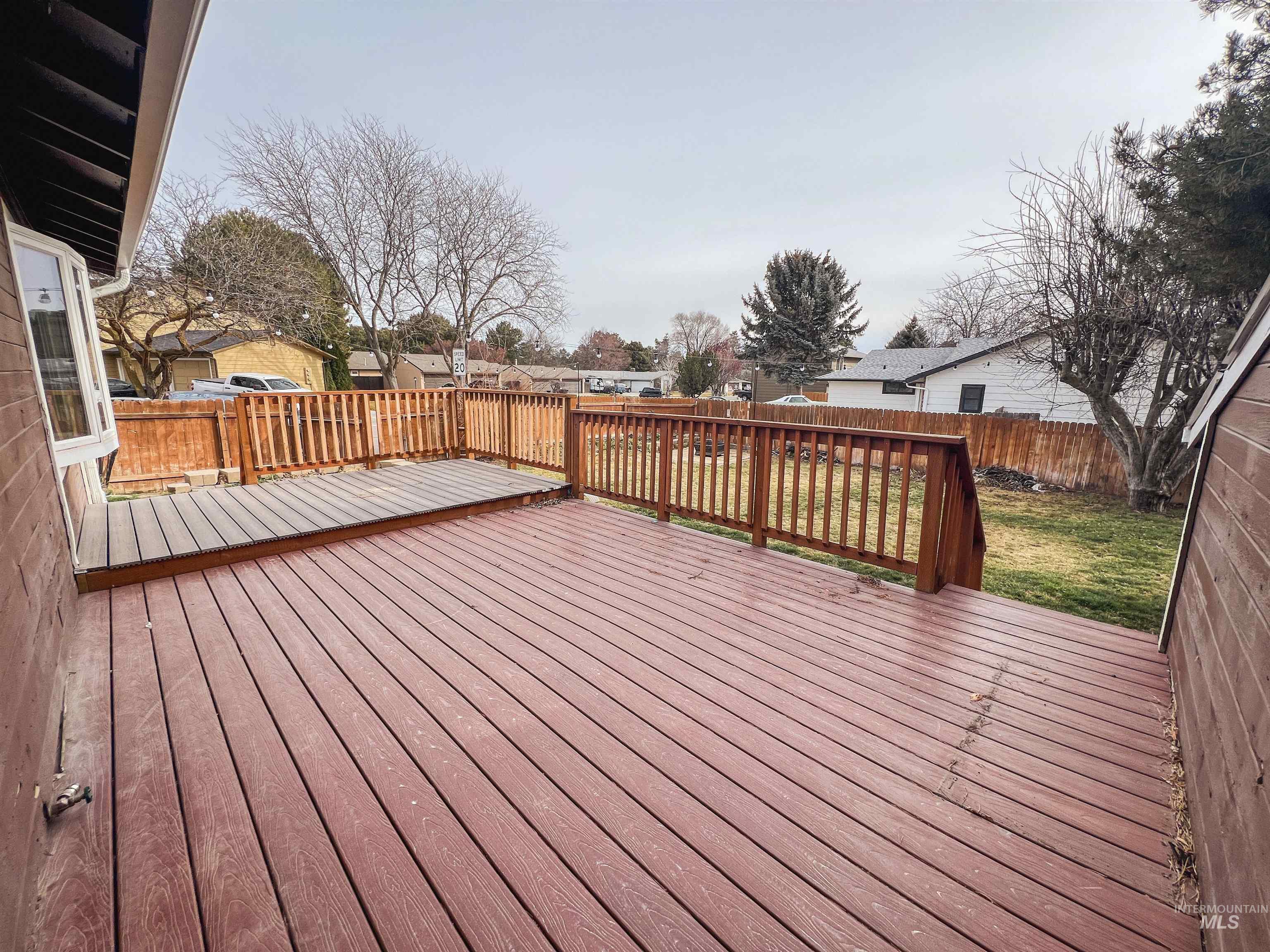 Deck featuring a fenced backyard and a residential view