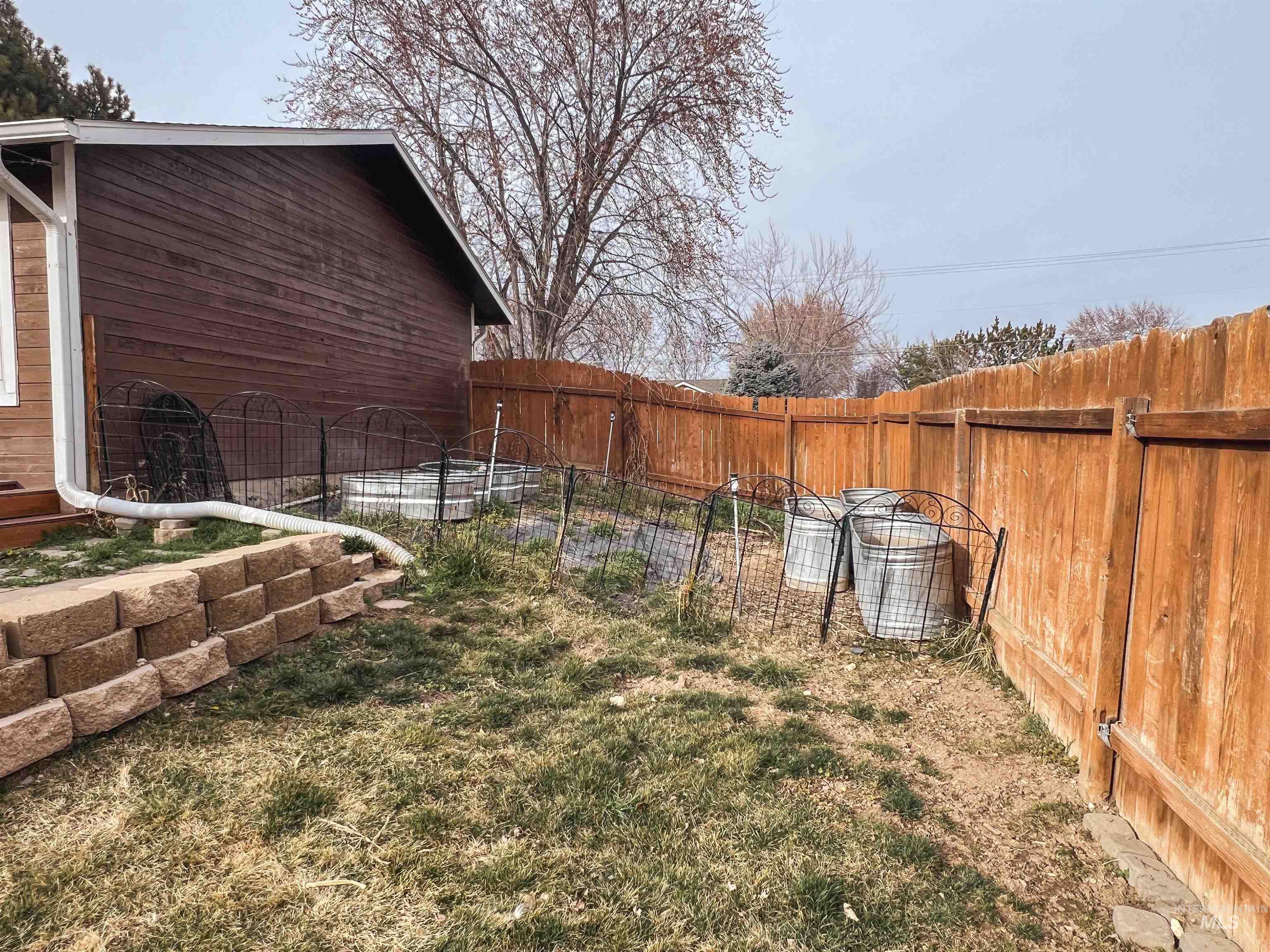View of fenced backyard