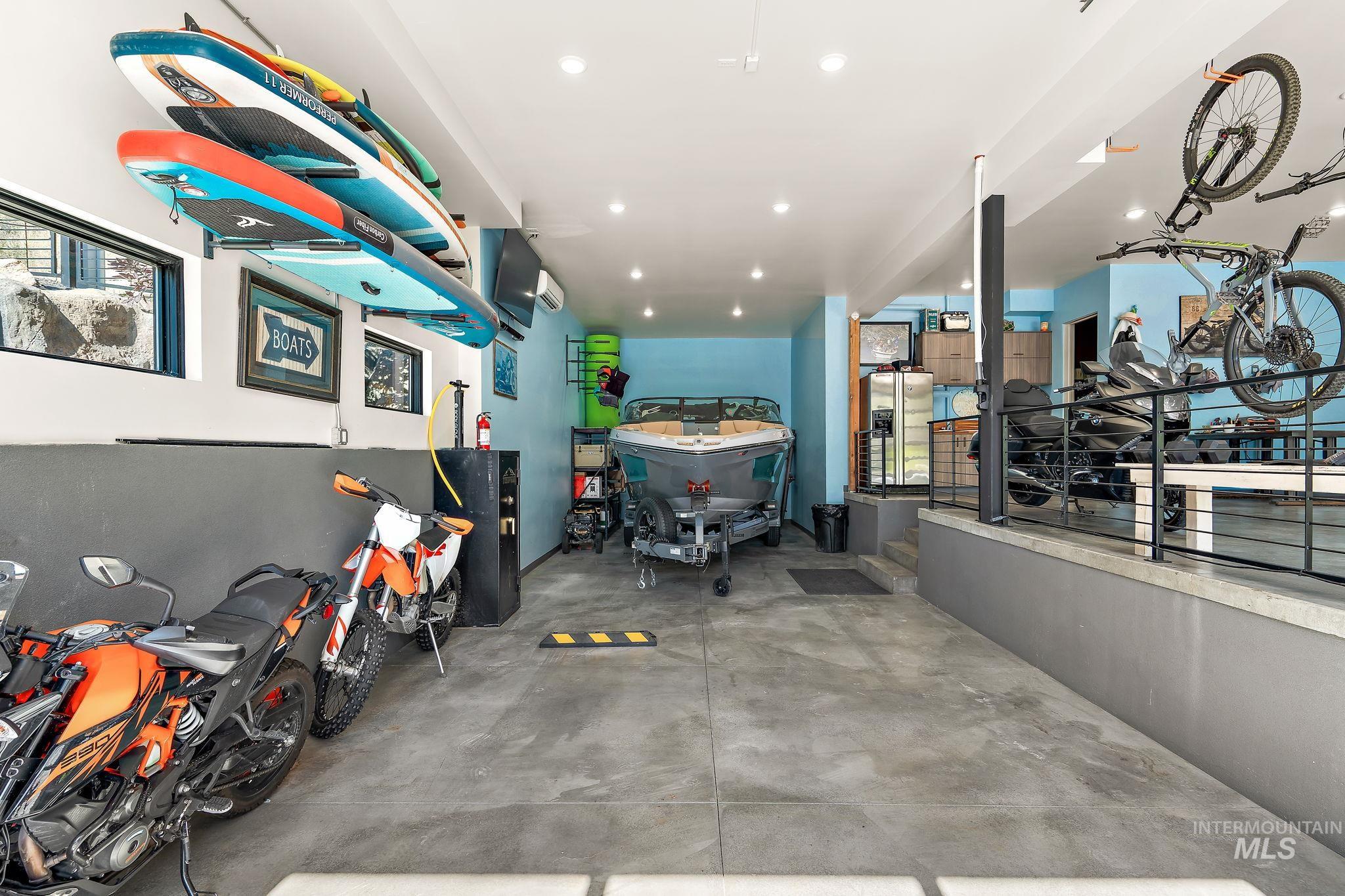 Spacious garage featuring concrete flooring and recessed lighting