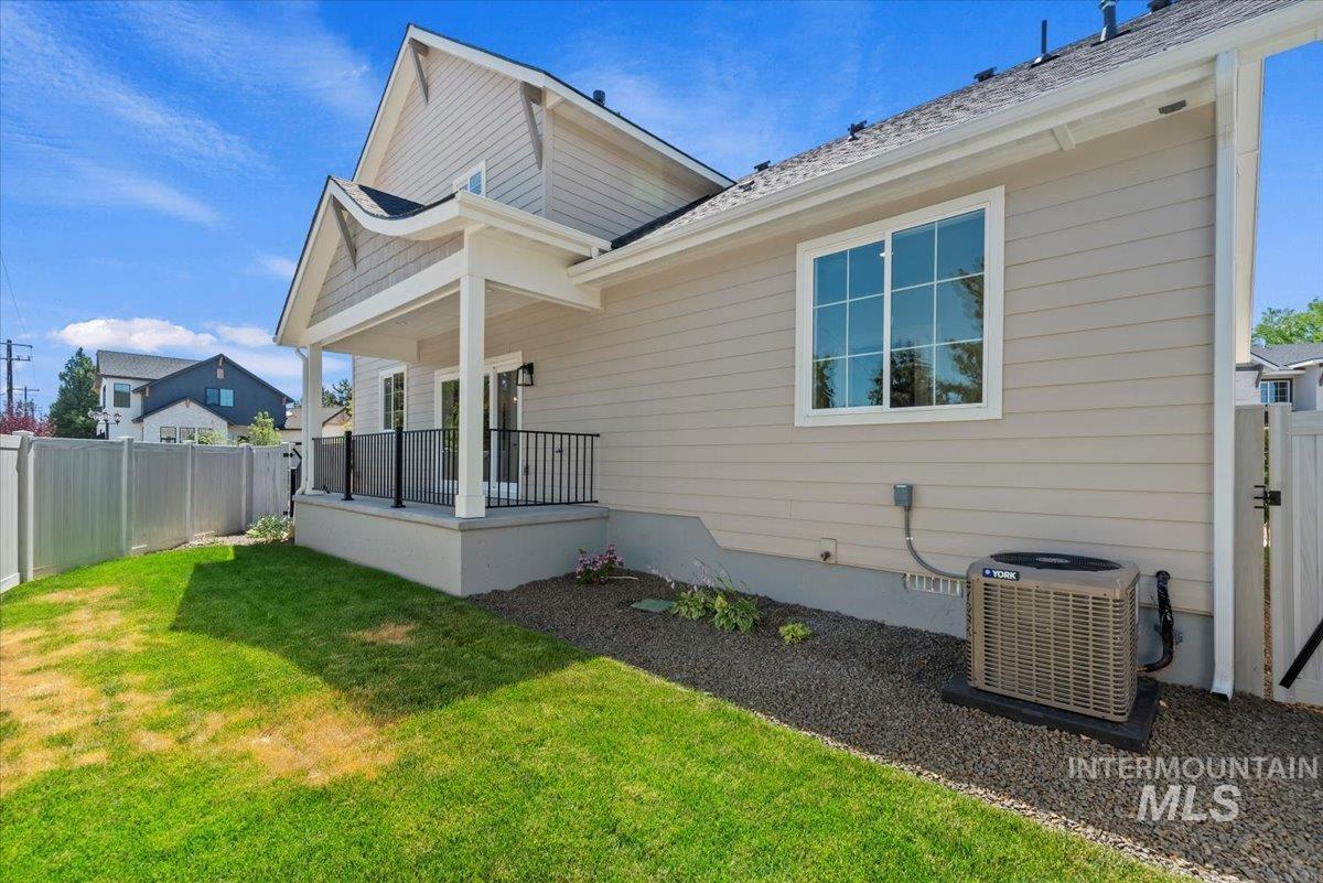 Back of house with a porch, a fenced backyard, and crawl space