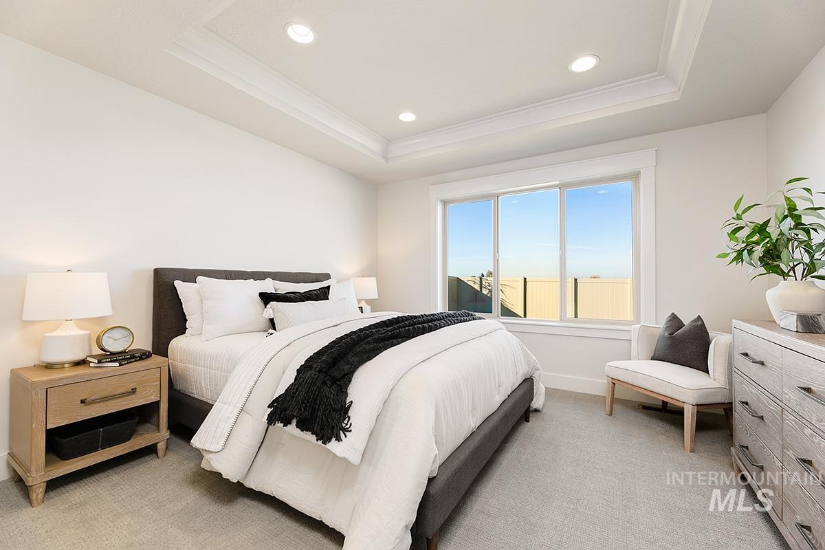 Recessed lighting illuminates a tray ceiling