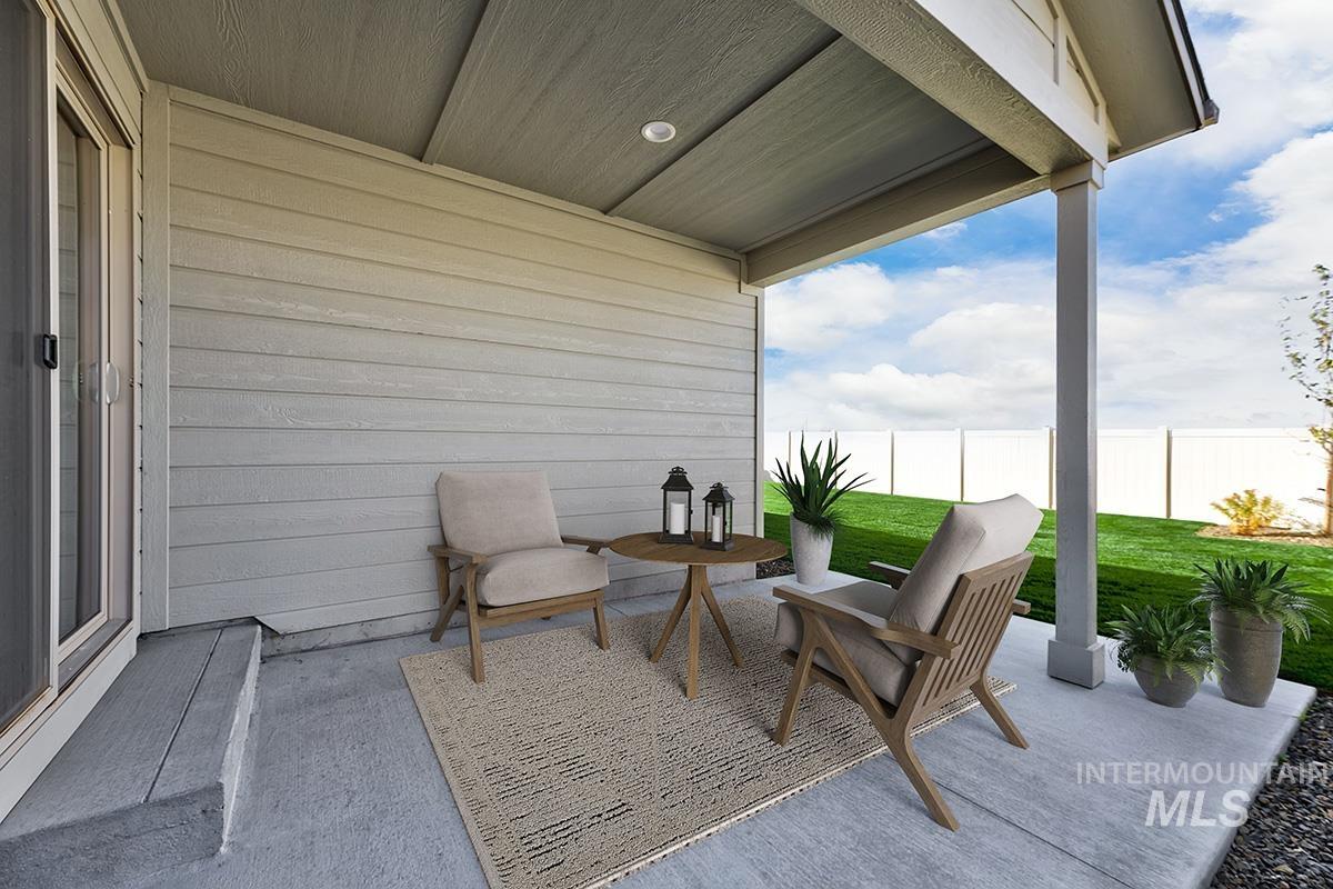 Covered concrete patio with a recessed overhead light, siding exterior, and a sliding glass door