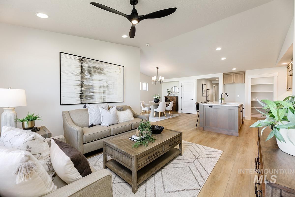 Open-concept living space with wood-finish flooring