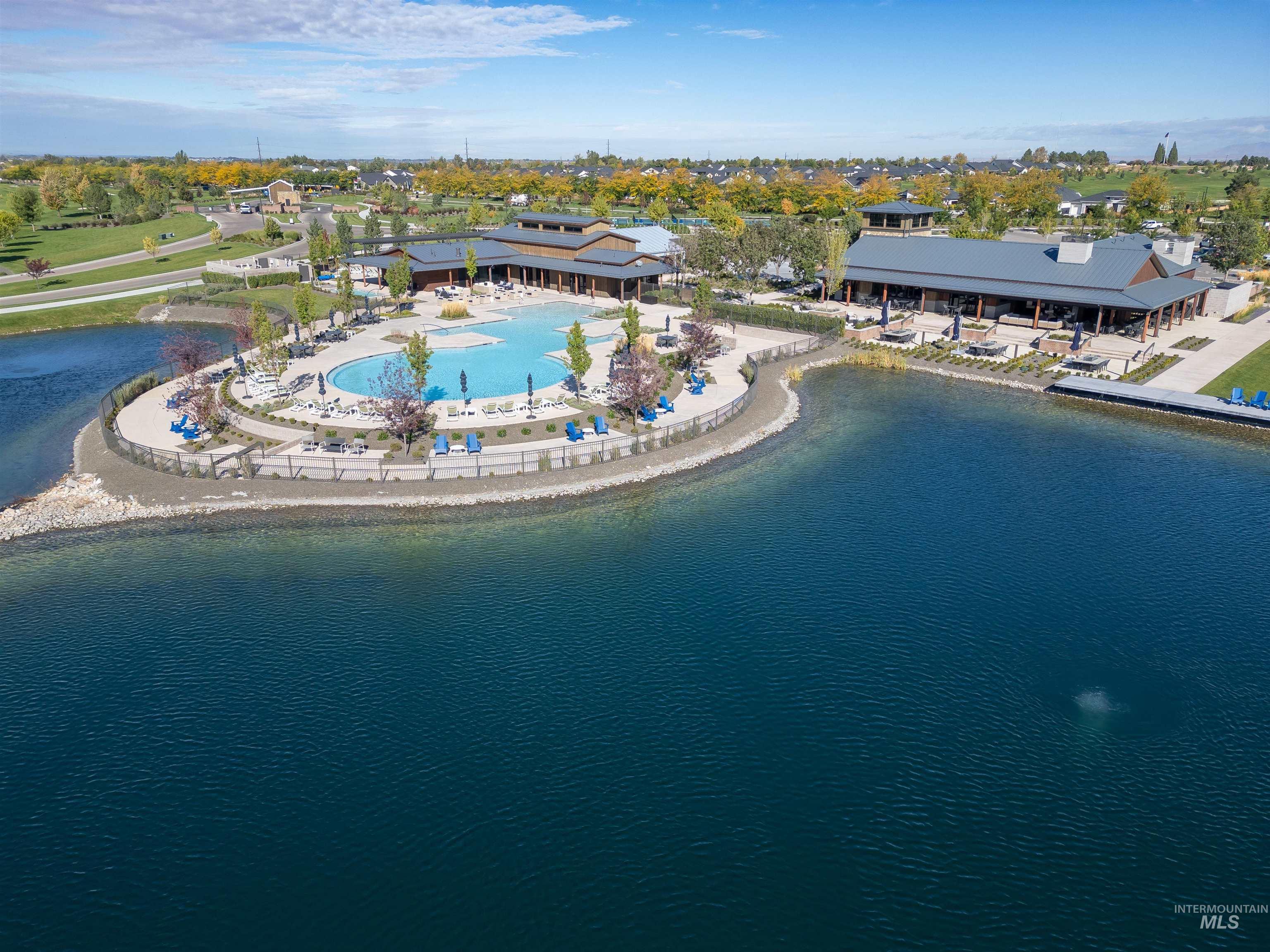 Bird's eye view of a pool and a large body of water