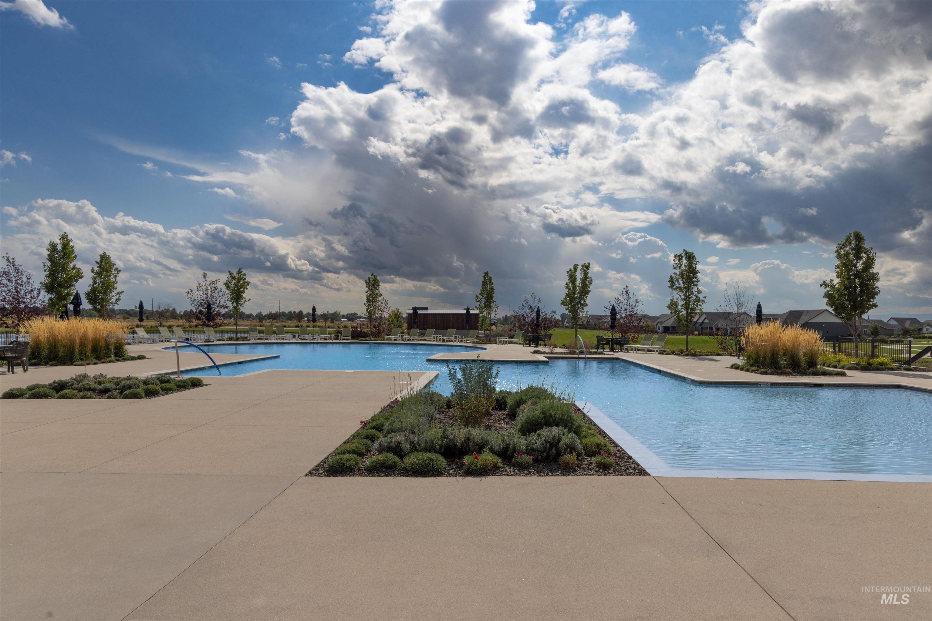 Community pool featuring a patio area