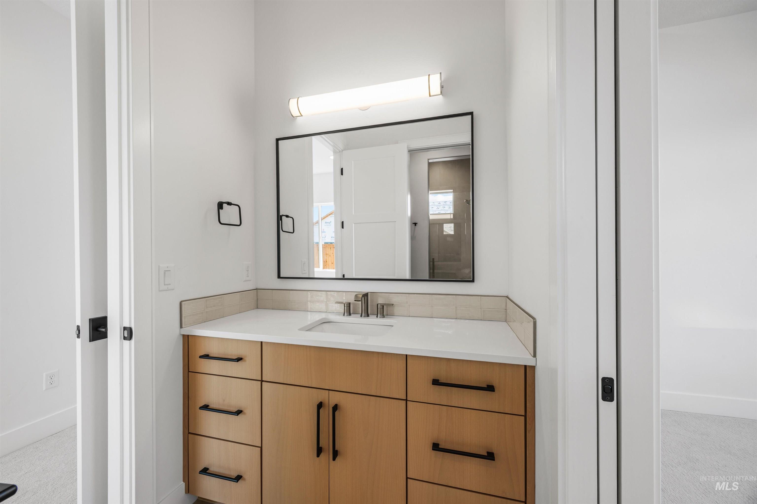 Bathroom with baseboards and vanity