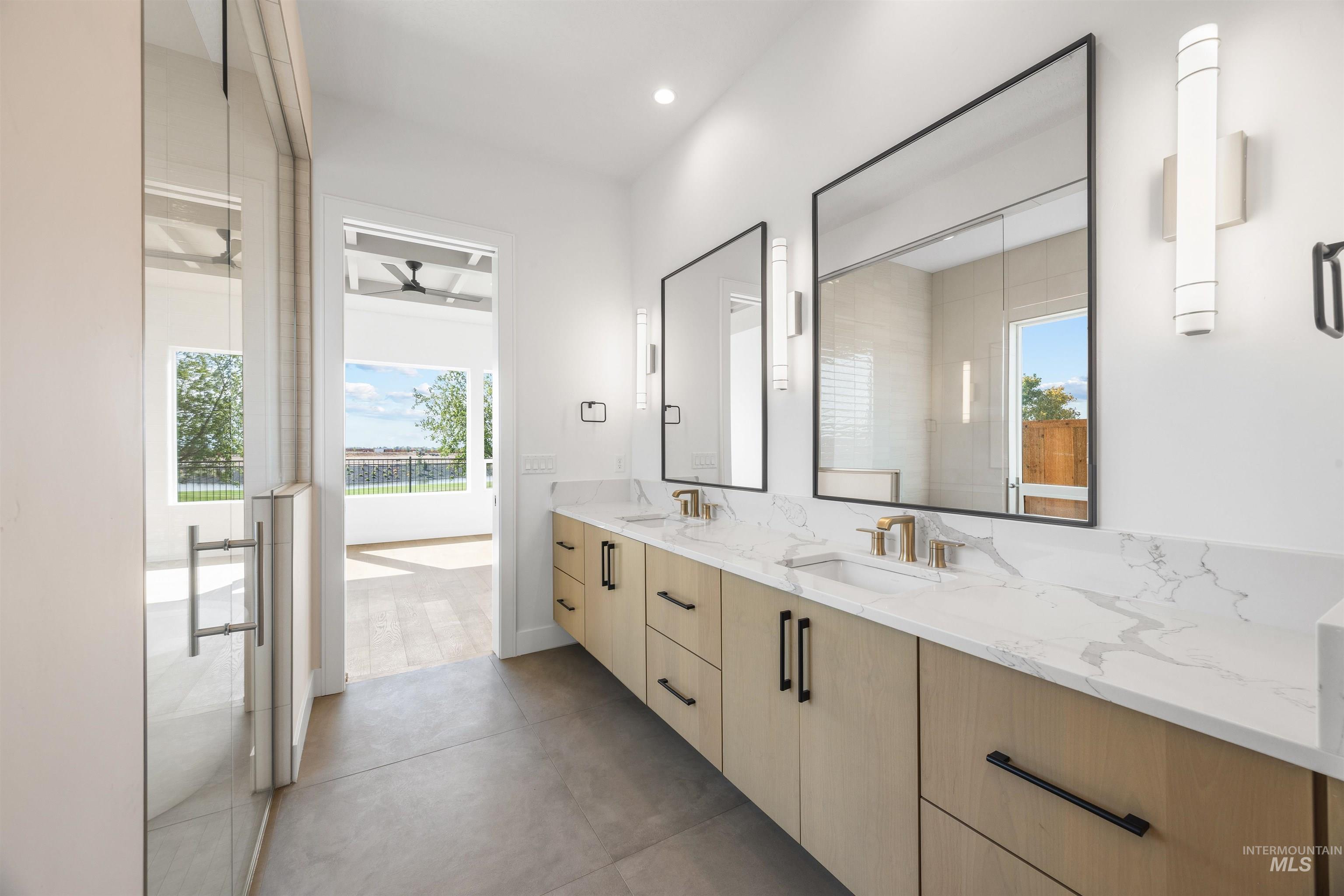 Bathroom with double vanity and recessed lighting