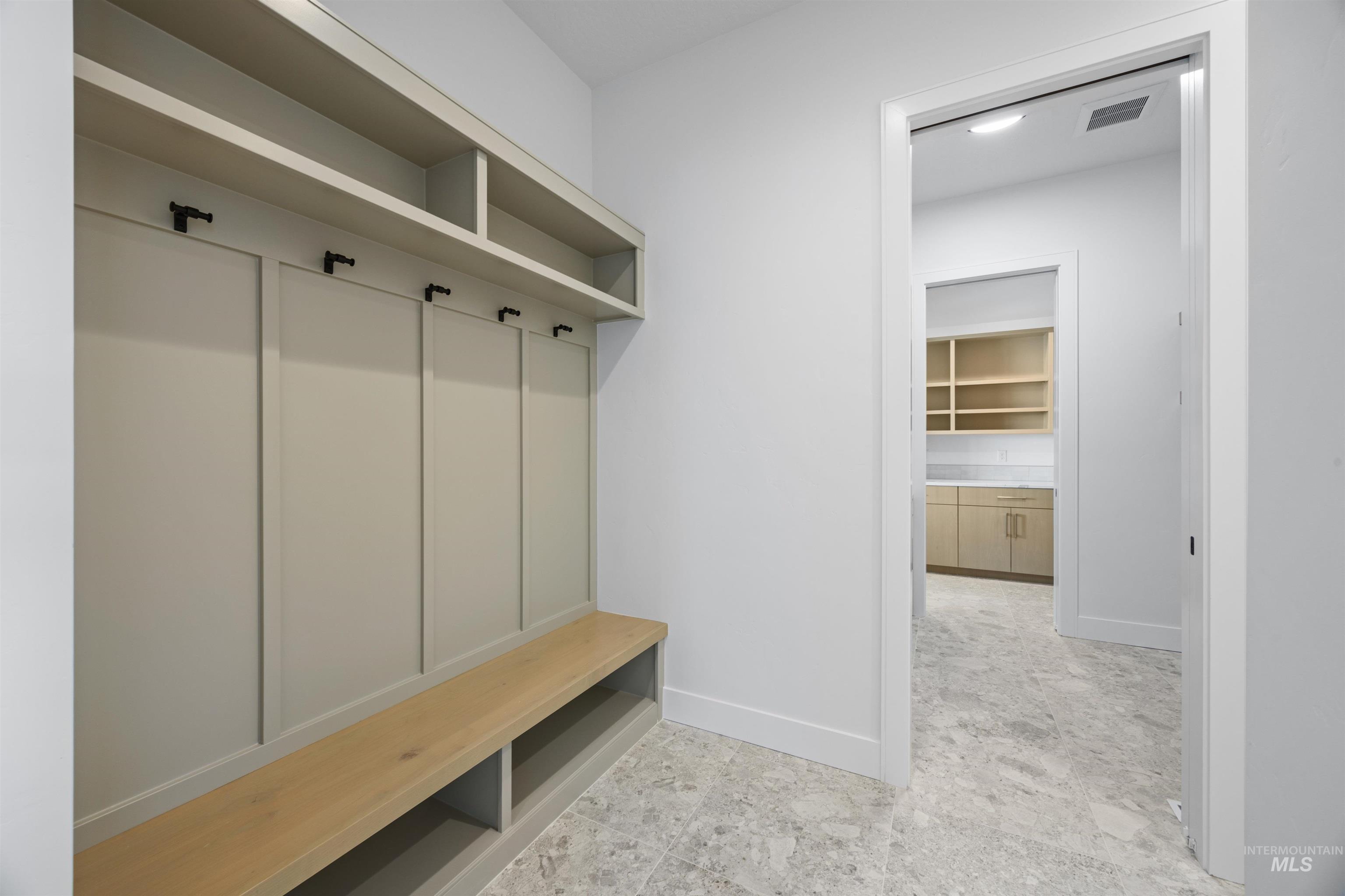Mudroom featuring baseboards
