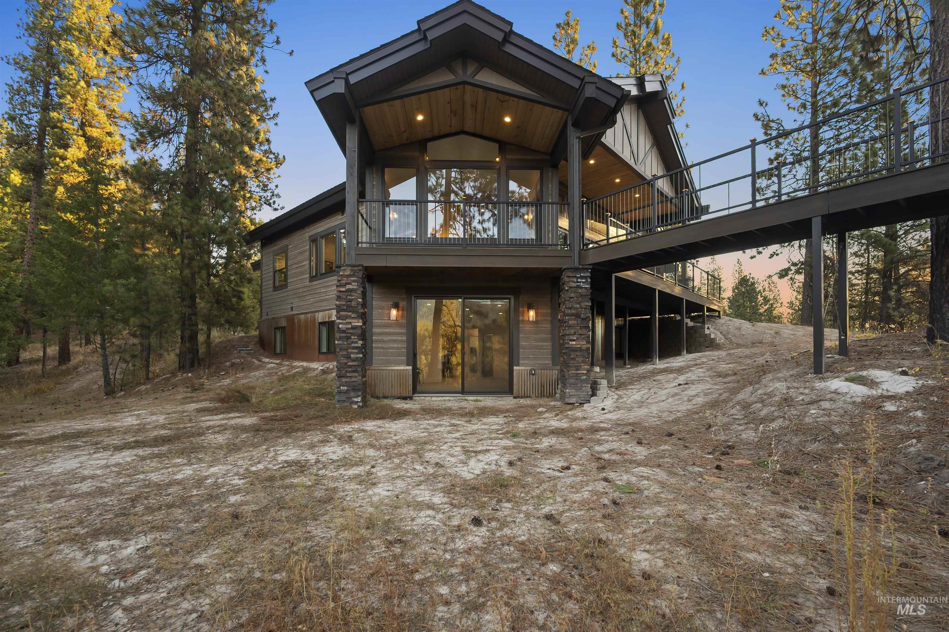 Back of house with a deck