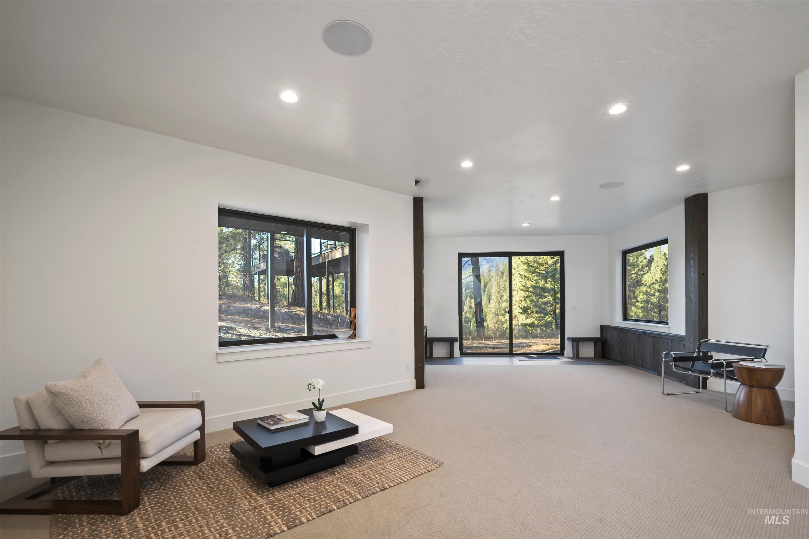 Sitting room with carpet and recessed lighting