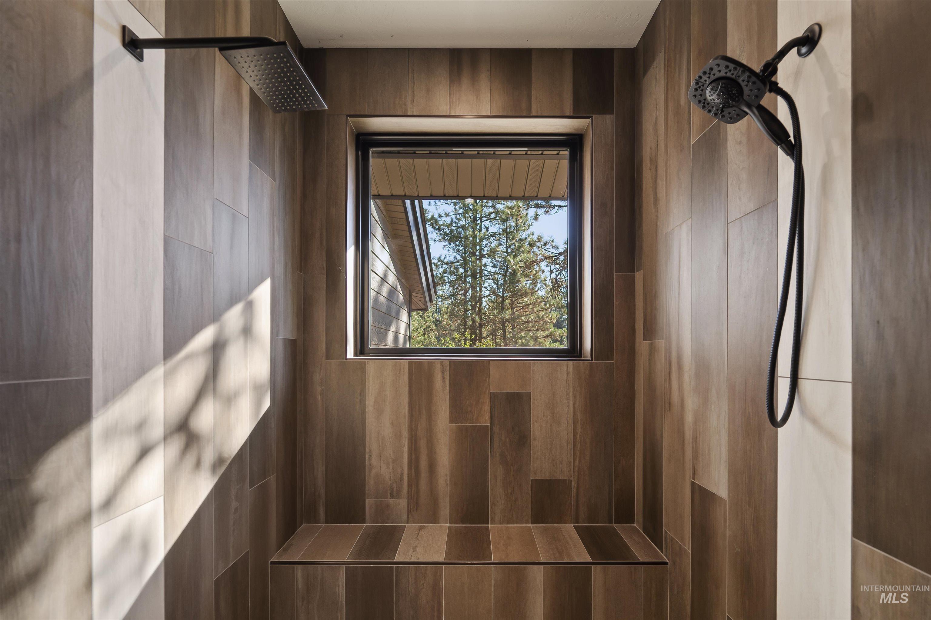 Bathroom view of a tile shower