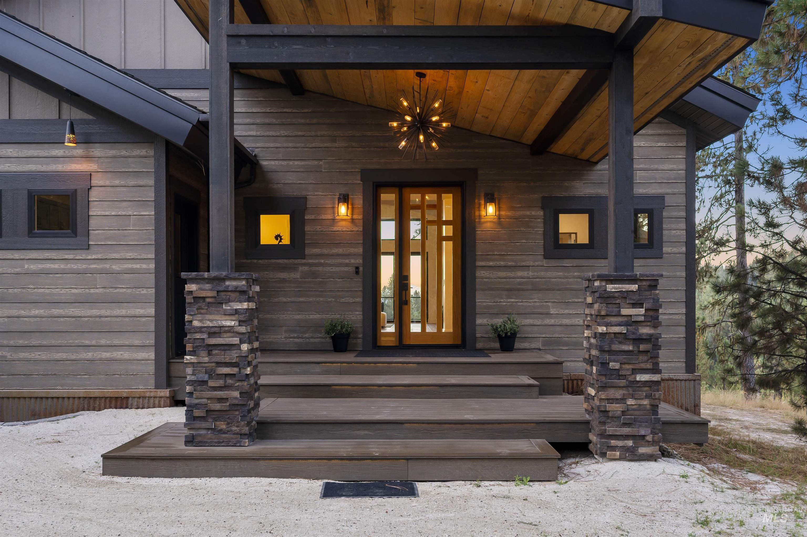 Entrance to property featuring covered porch