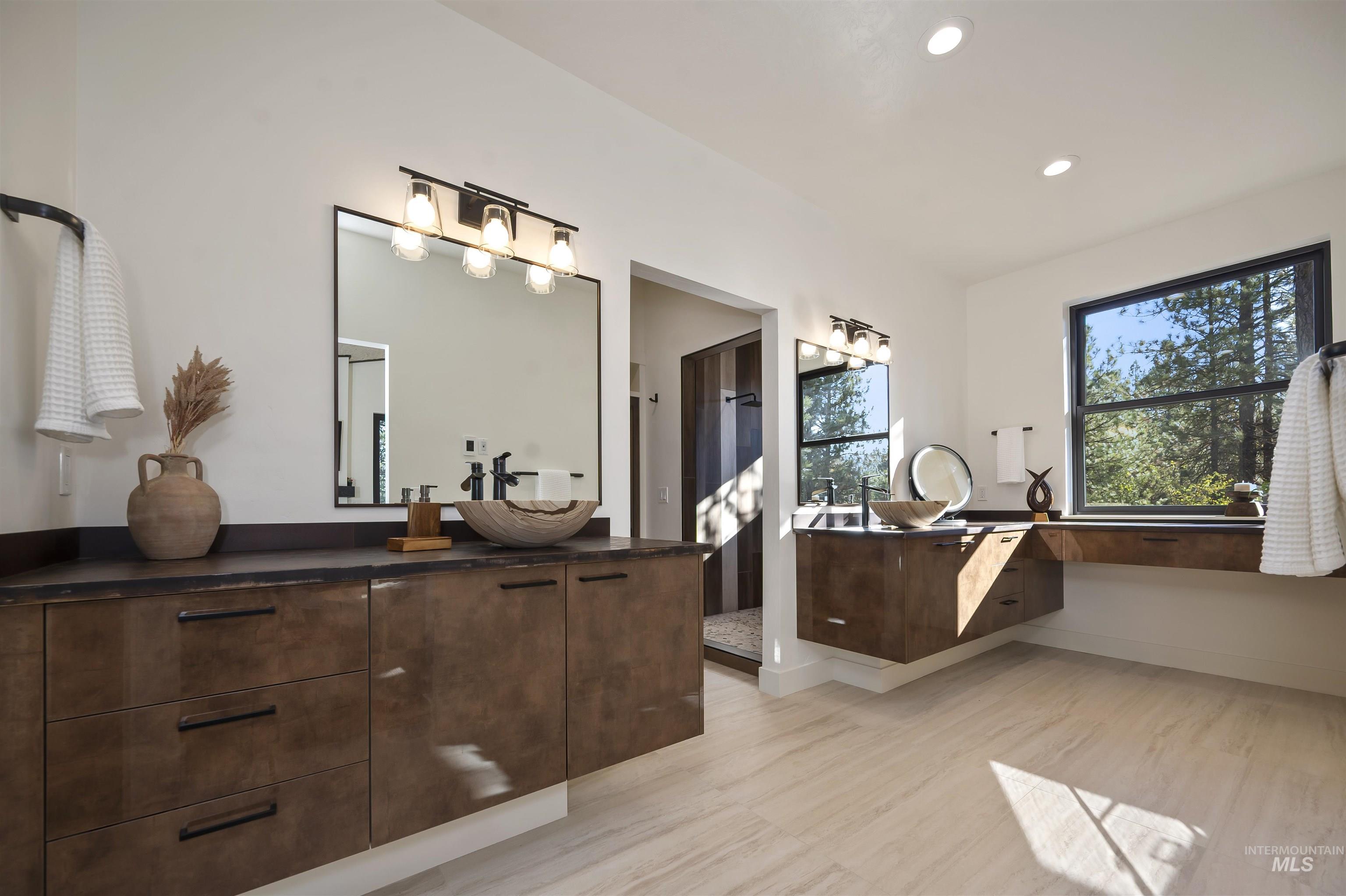 Full bath featuring vanity, recessed lighting, and wood finished floors