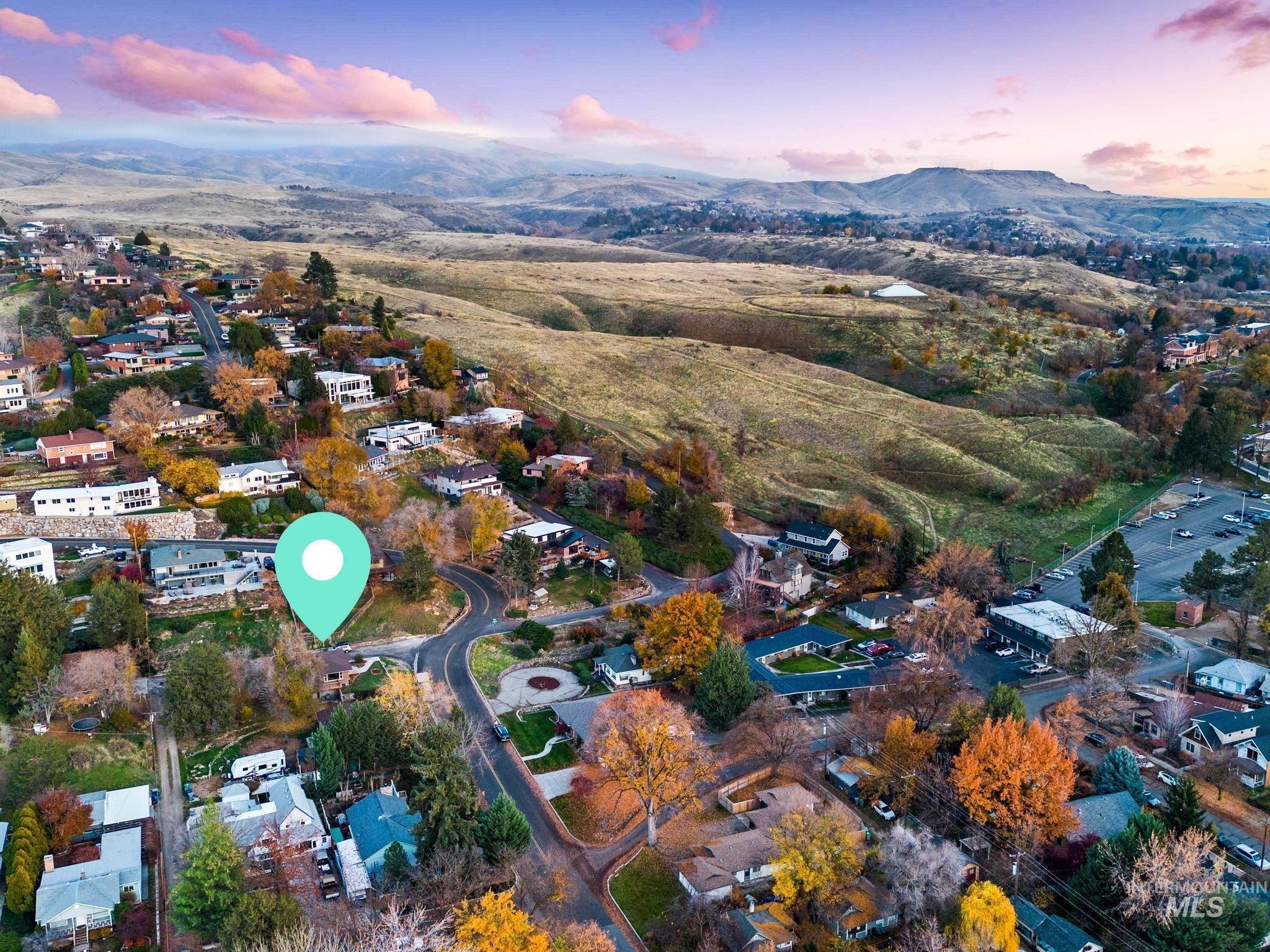 Aerial view at dusk of a mountain view and a residential view