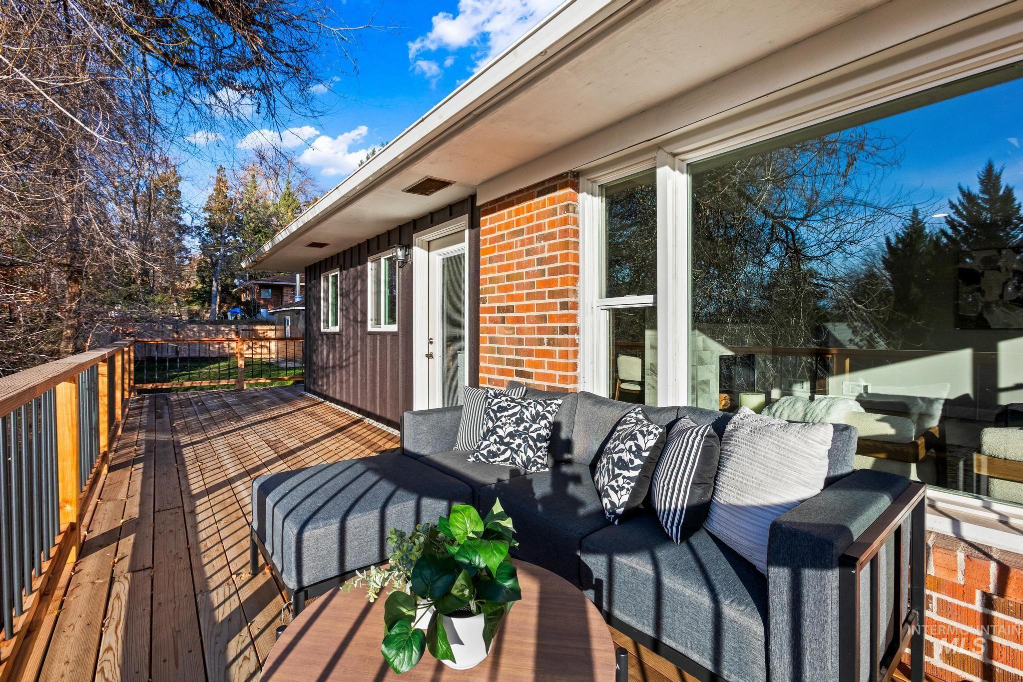 Wooden terrace featuring an outdoor living space
