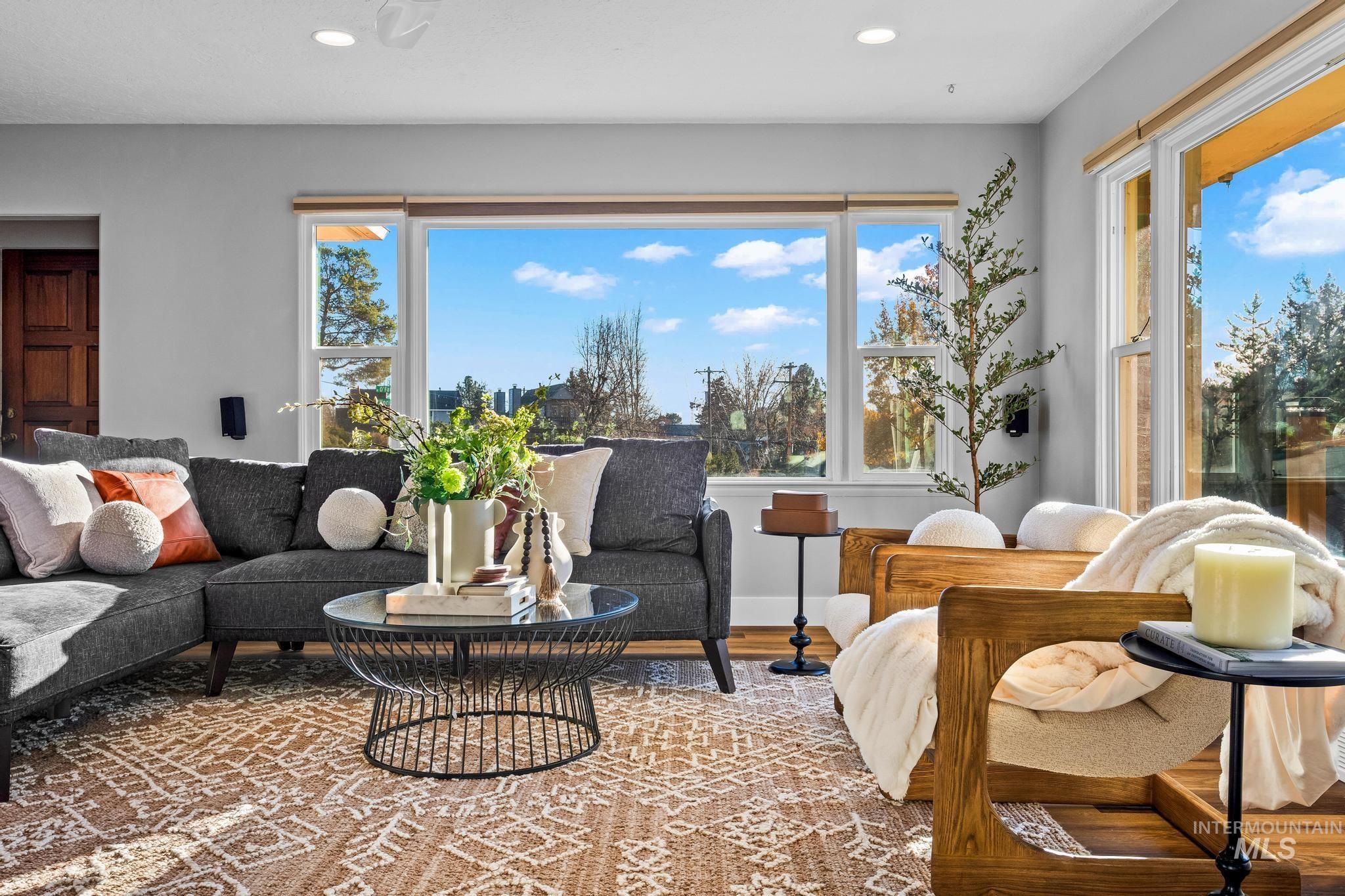 Living room with wood finished floors and recessed lighting
