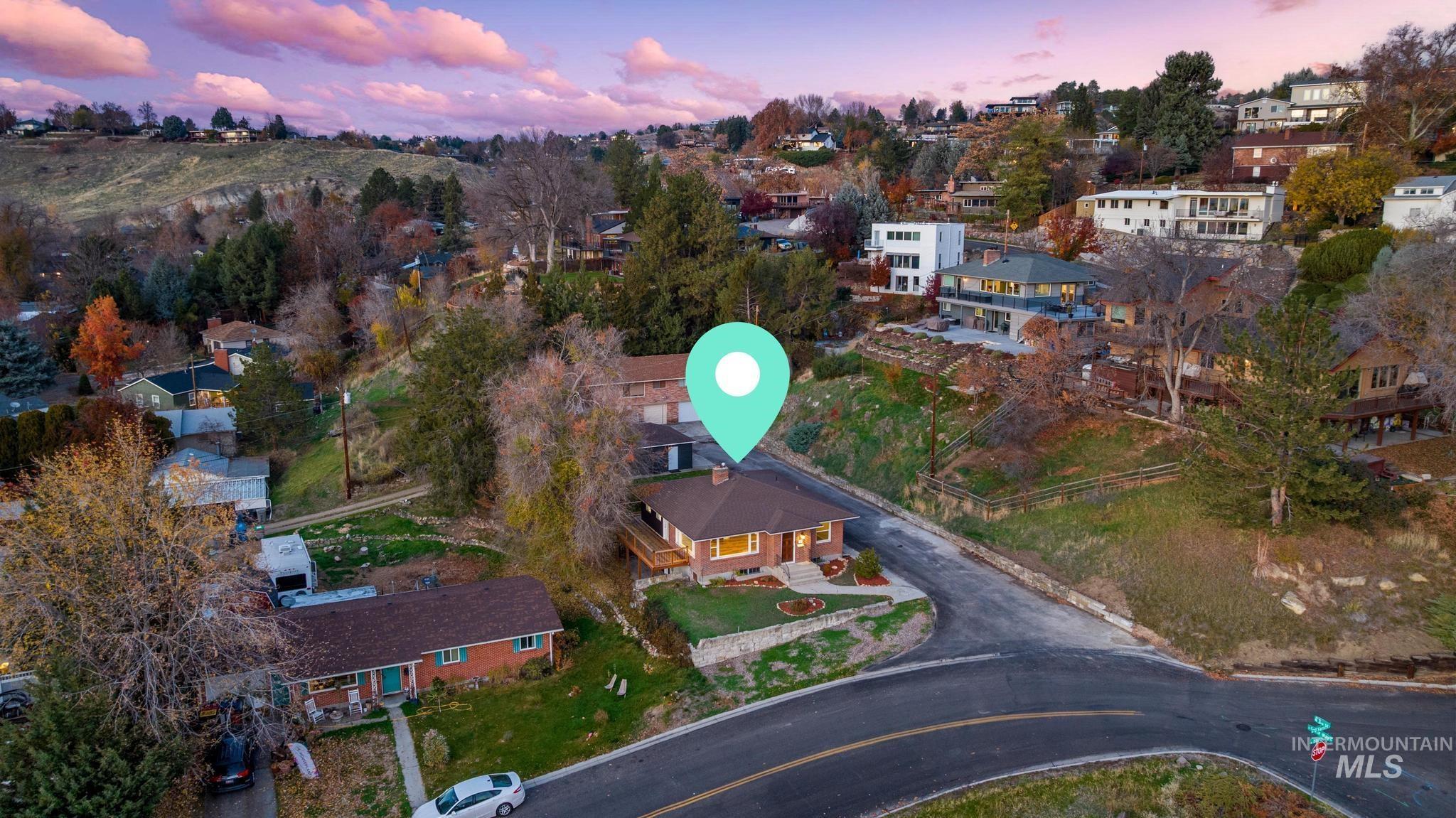 Aerial overview of property's location with nearby suburban area