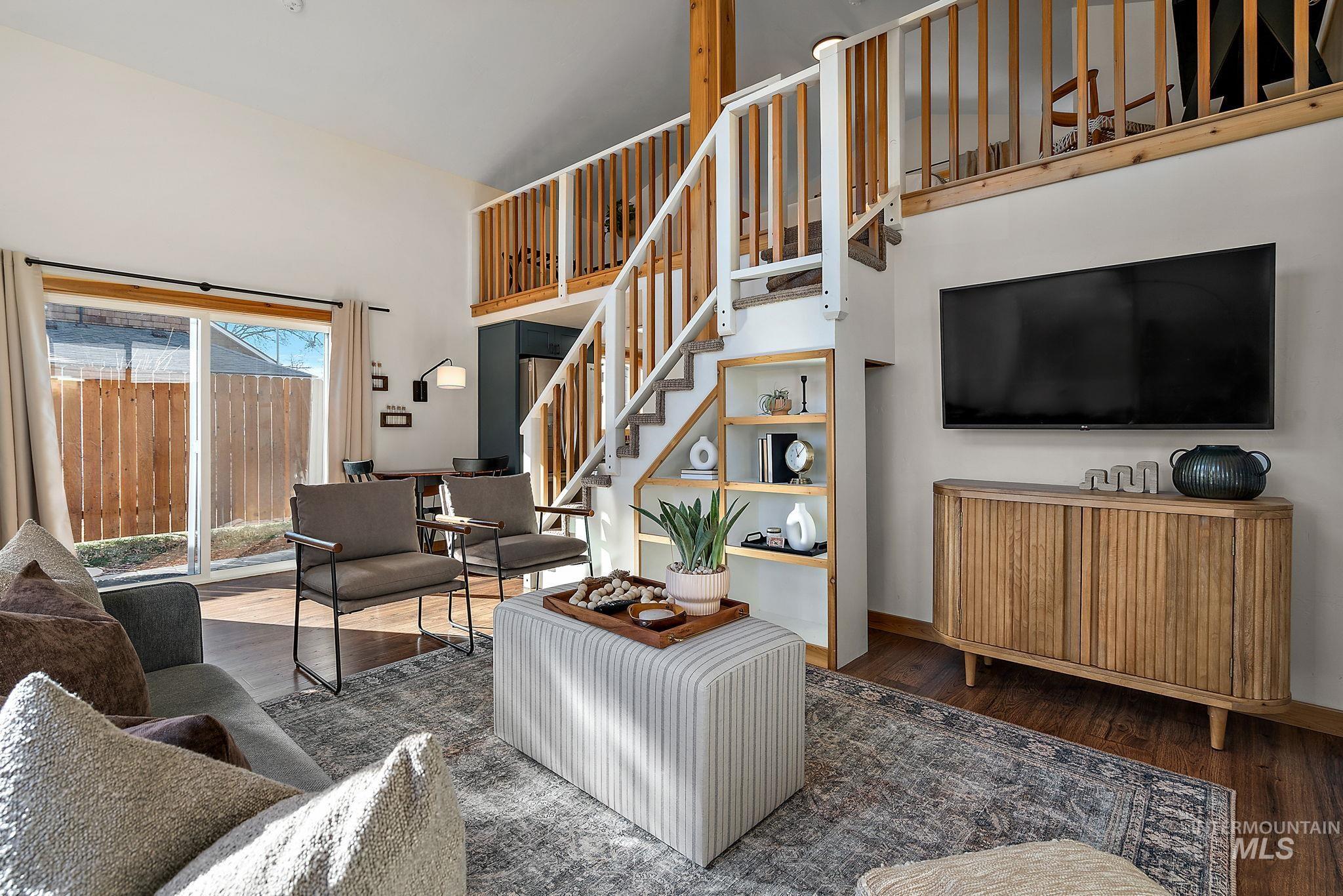 Living area featuring wood finished floors and stairs