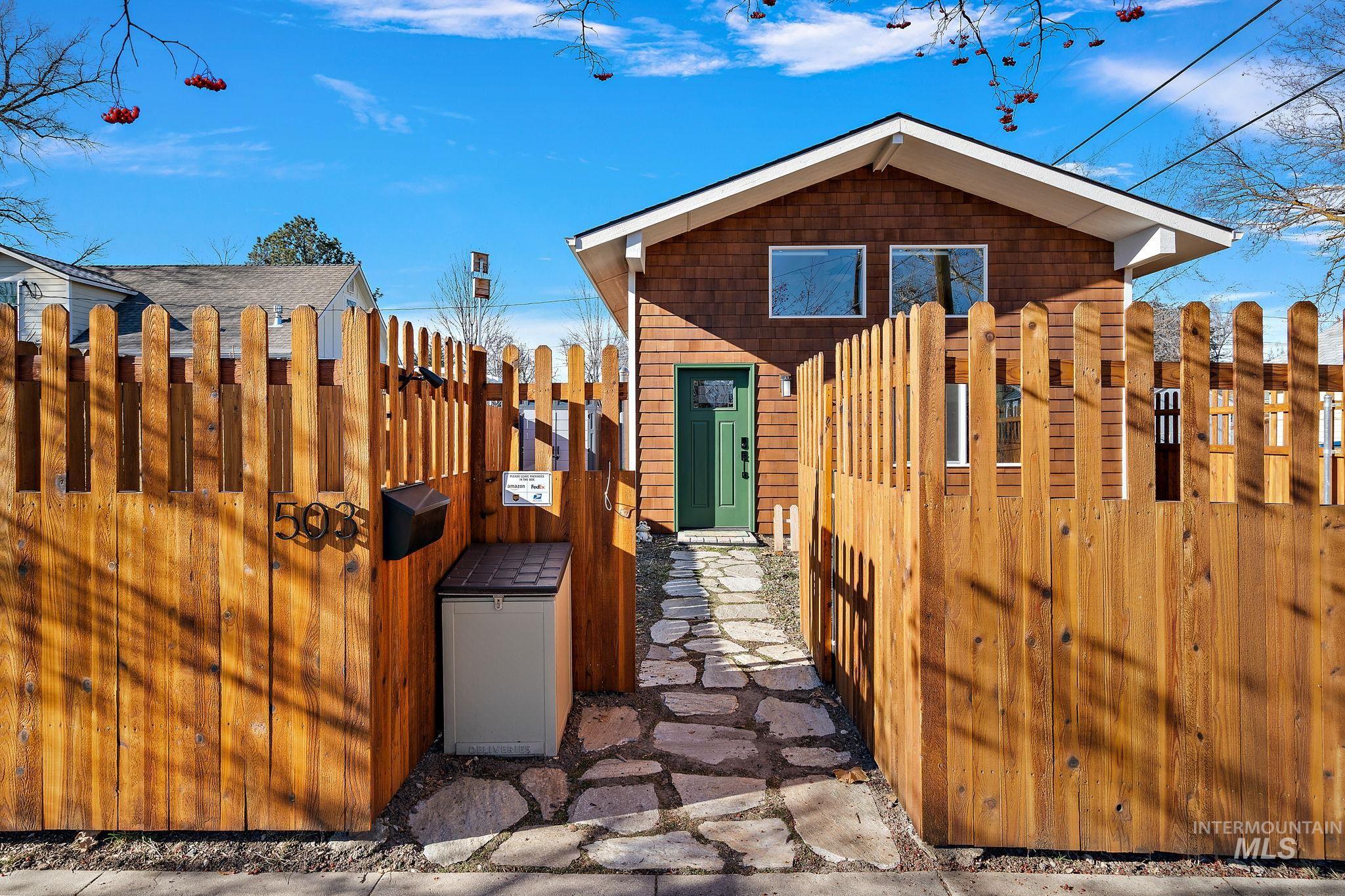 View of home's exterior featuring a gate