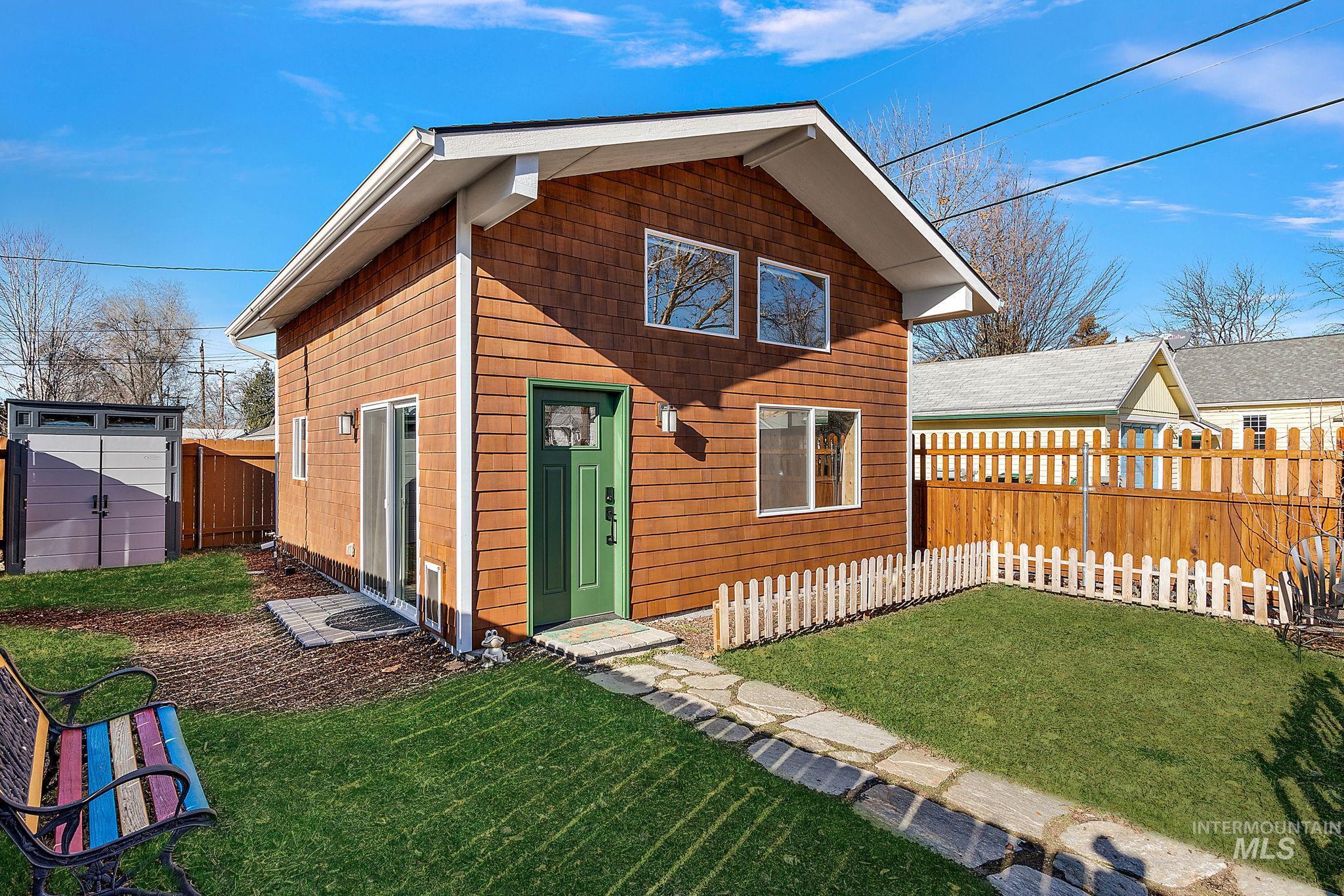 View of front facade with a fenced backyard