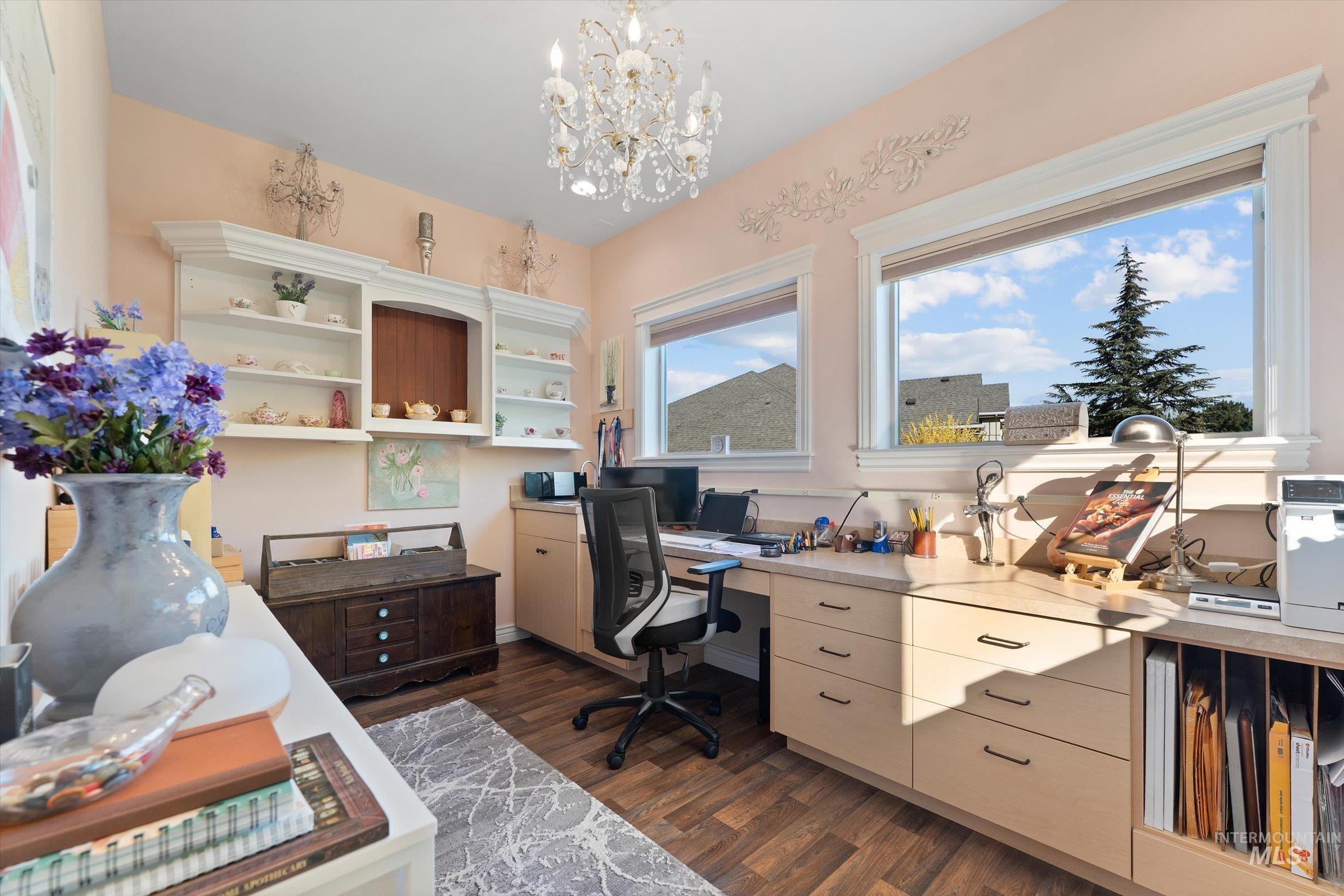 Office featuring dark wood finished floors and a chandelier