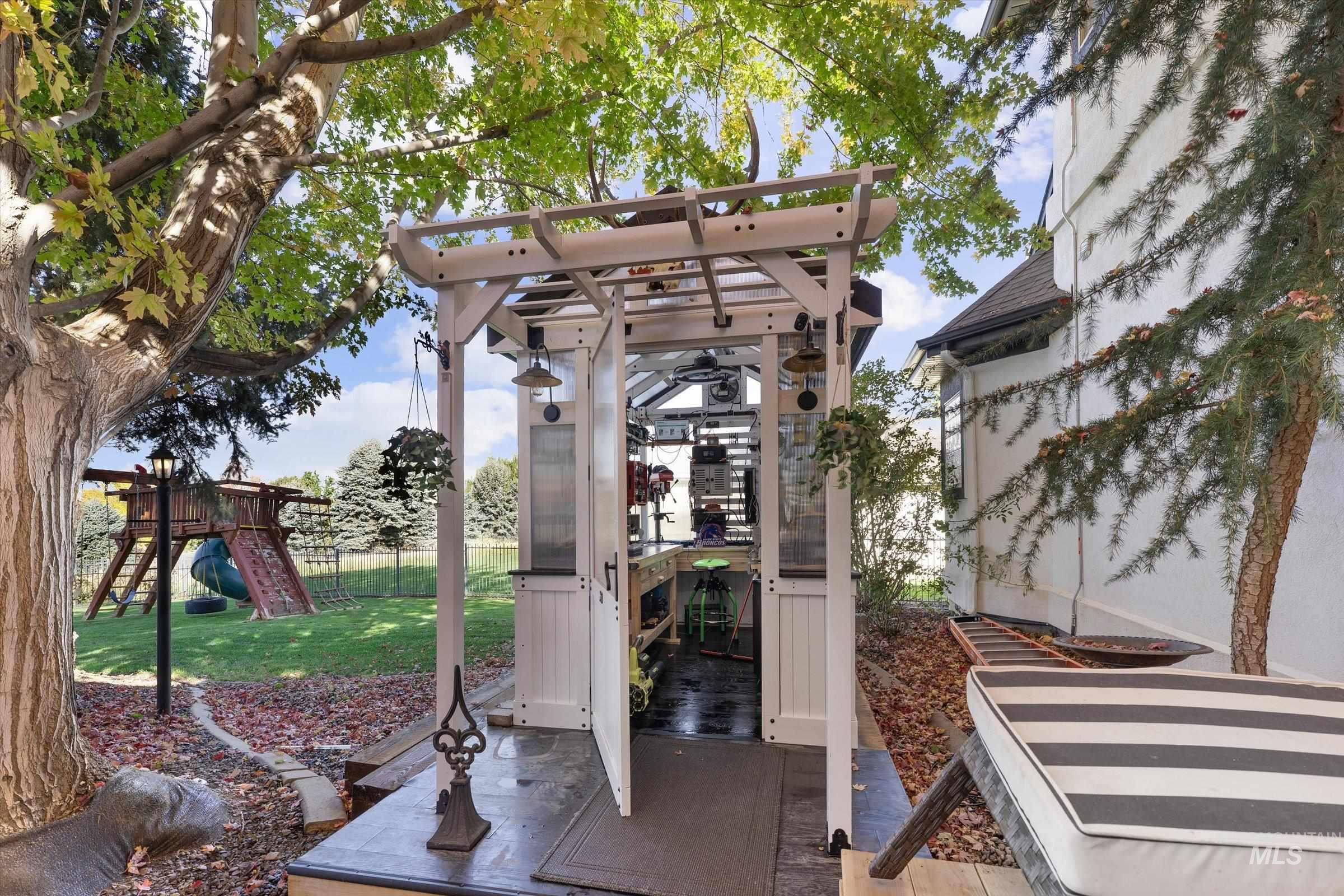 View of outbuilding featuring a playground and a gazebo