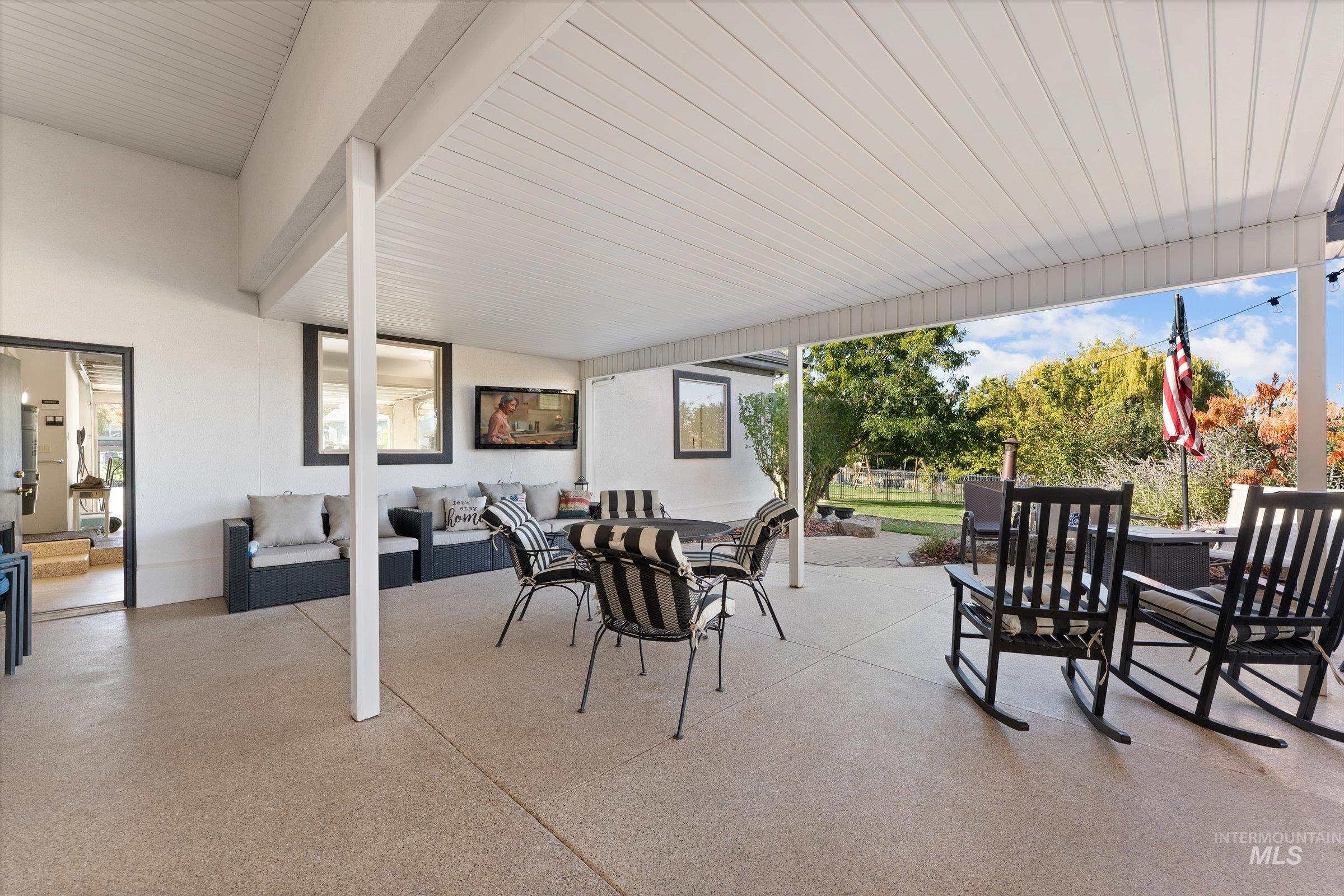 View of patio with an outdoor hangout area and outdoor dining space