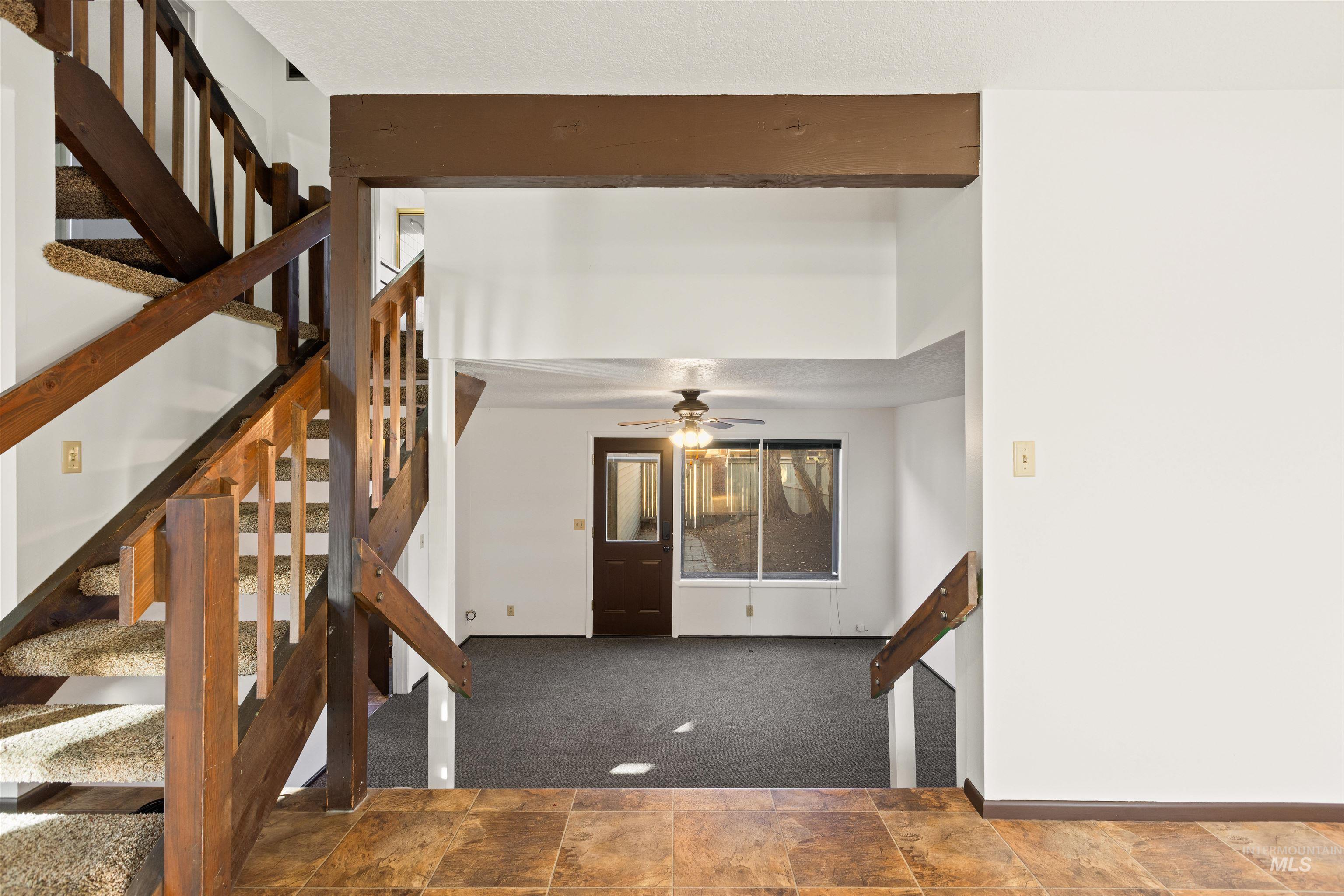 Stairway with carpet and stone finish flooring