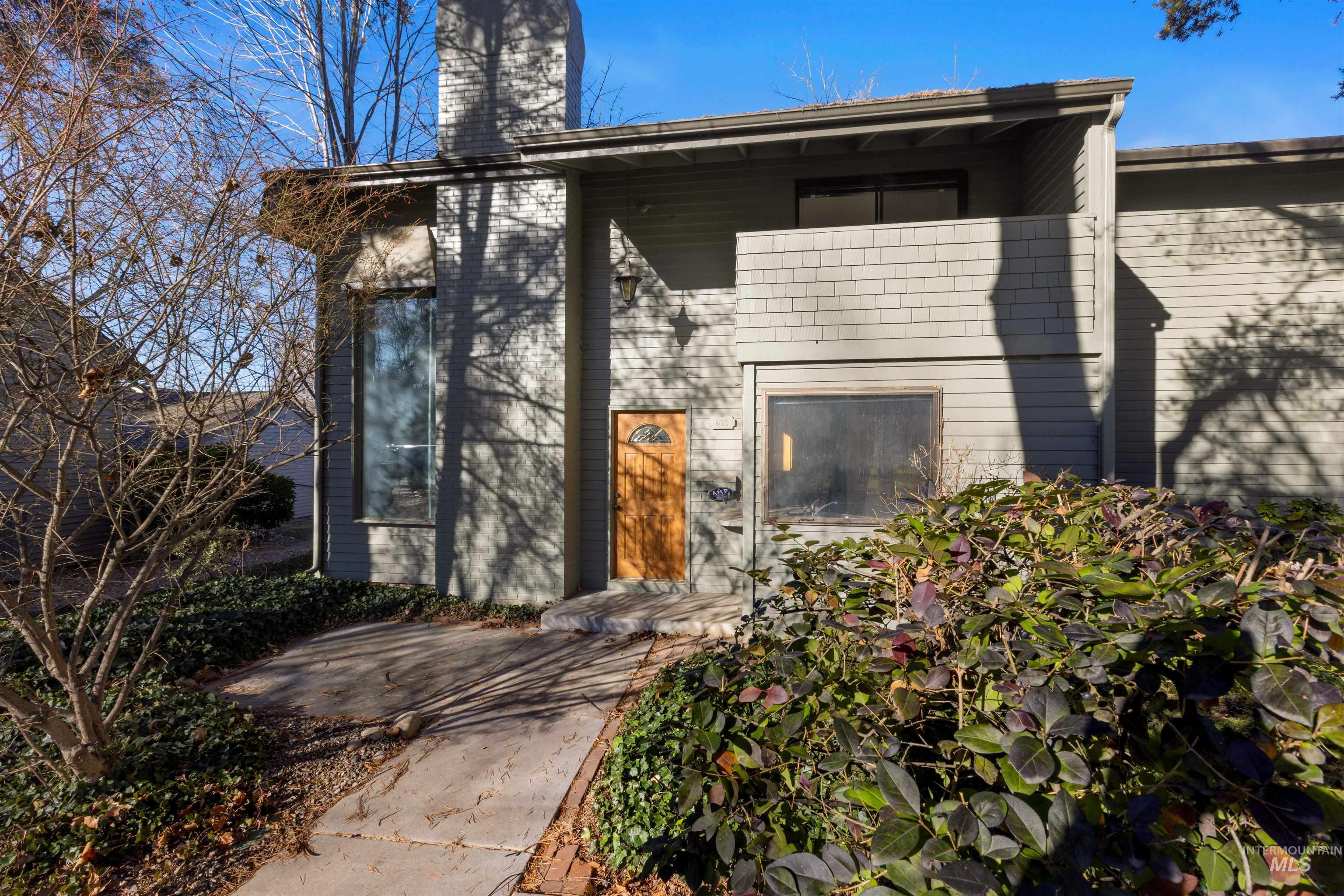 Doorway to property with a chimney