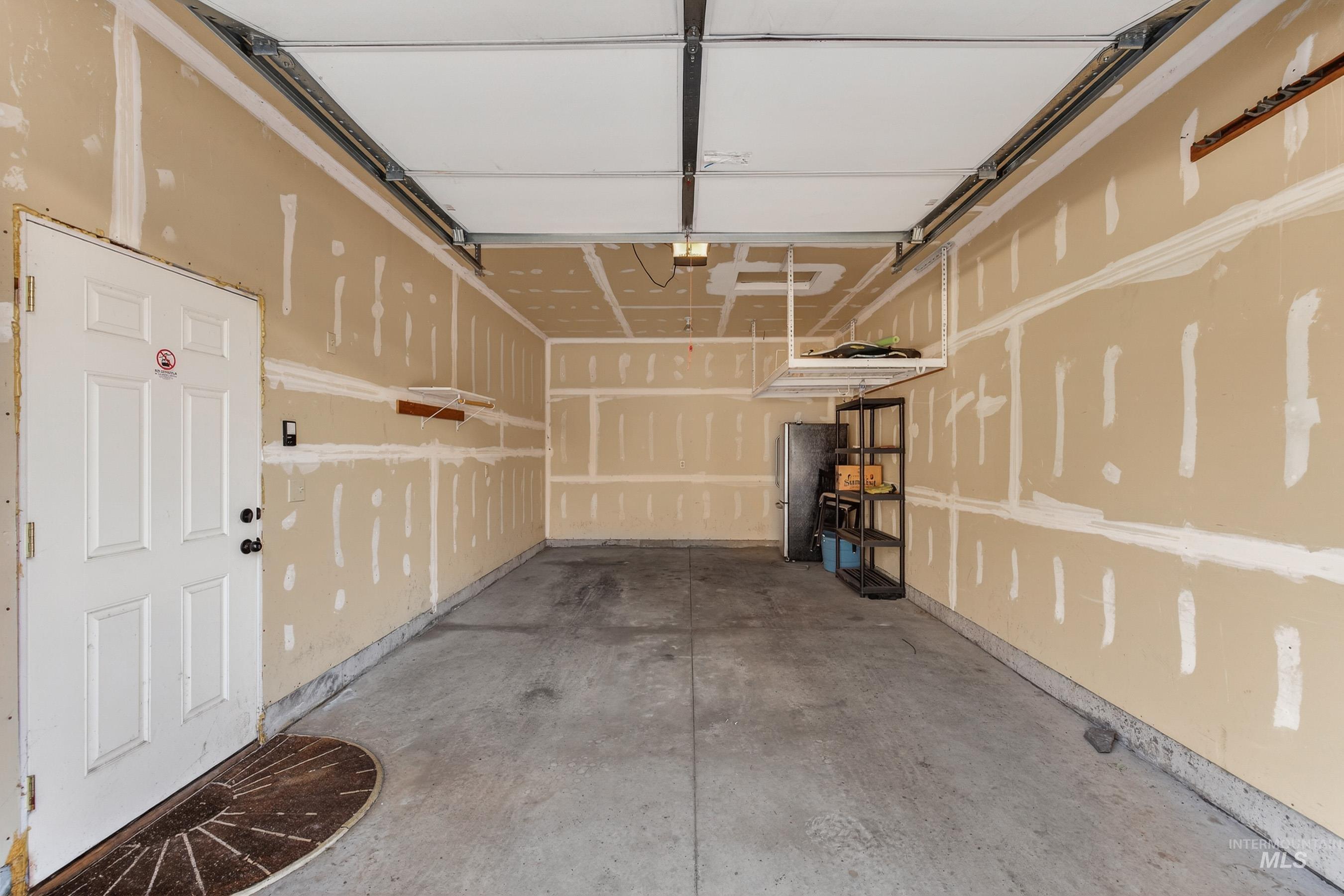 Garage with freestanding refrigerator