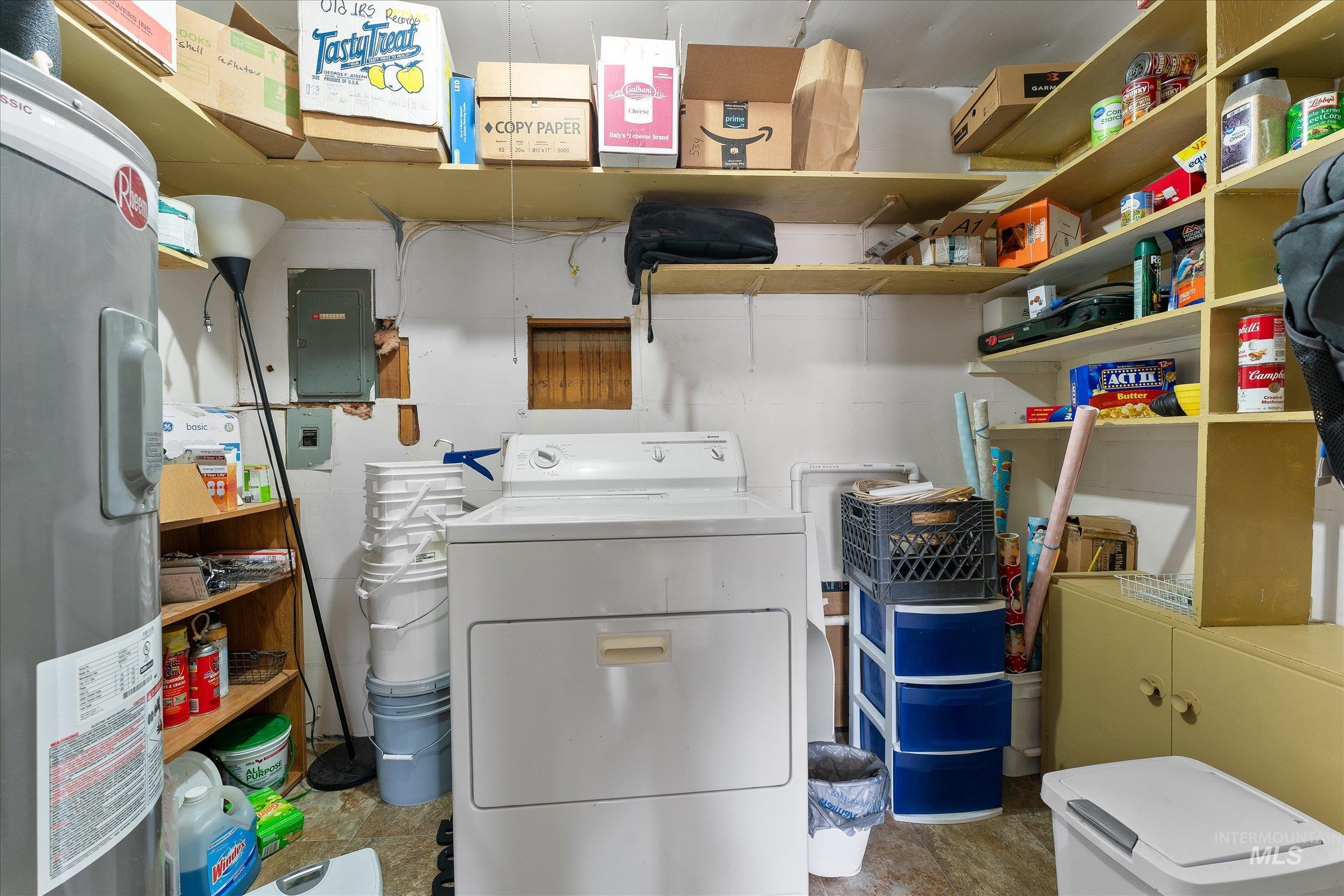 Washroom featuring electric water heater and electric panel