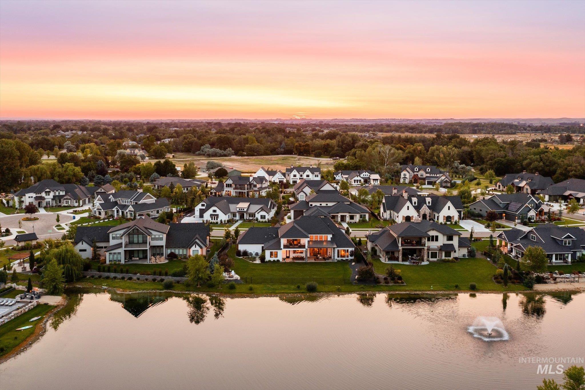 Aerial perspective of suburban area with a large body of water