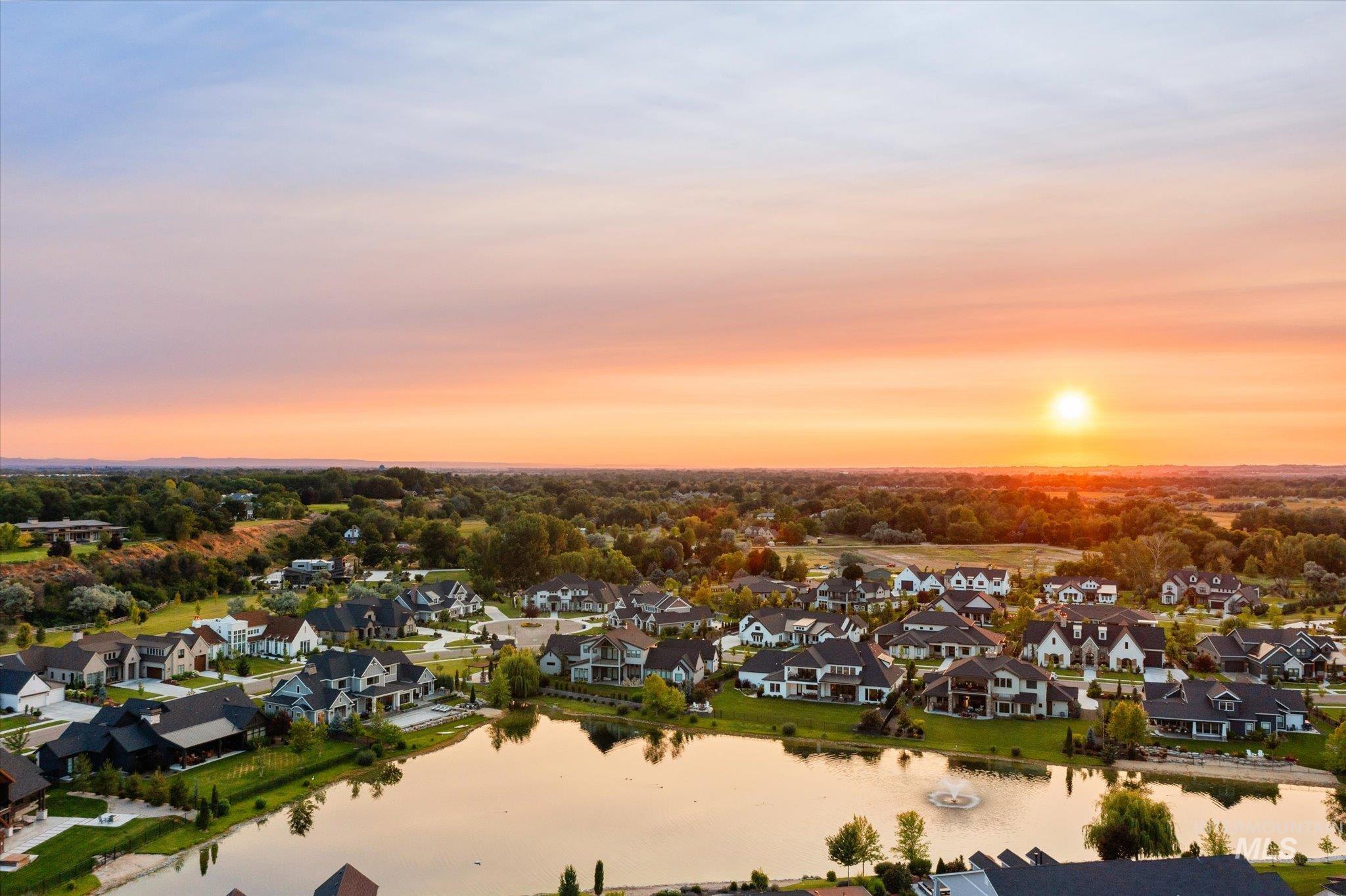 Aerial view at dusk of a residential view and a water view