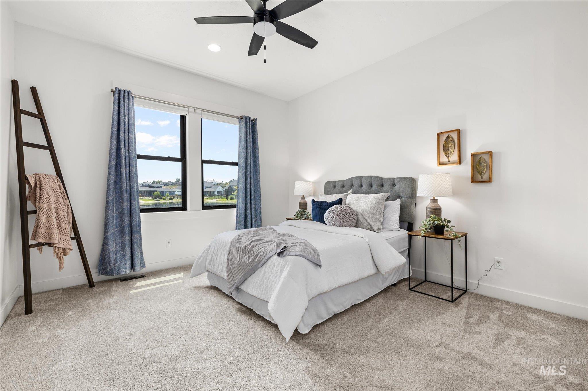 Bedroom featuring carpet flooring, a ceiling fan, and recessed lighting