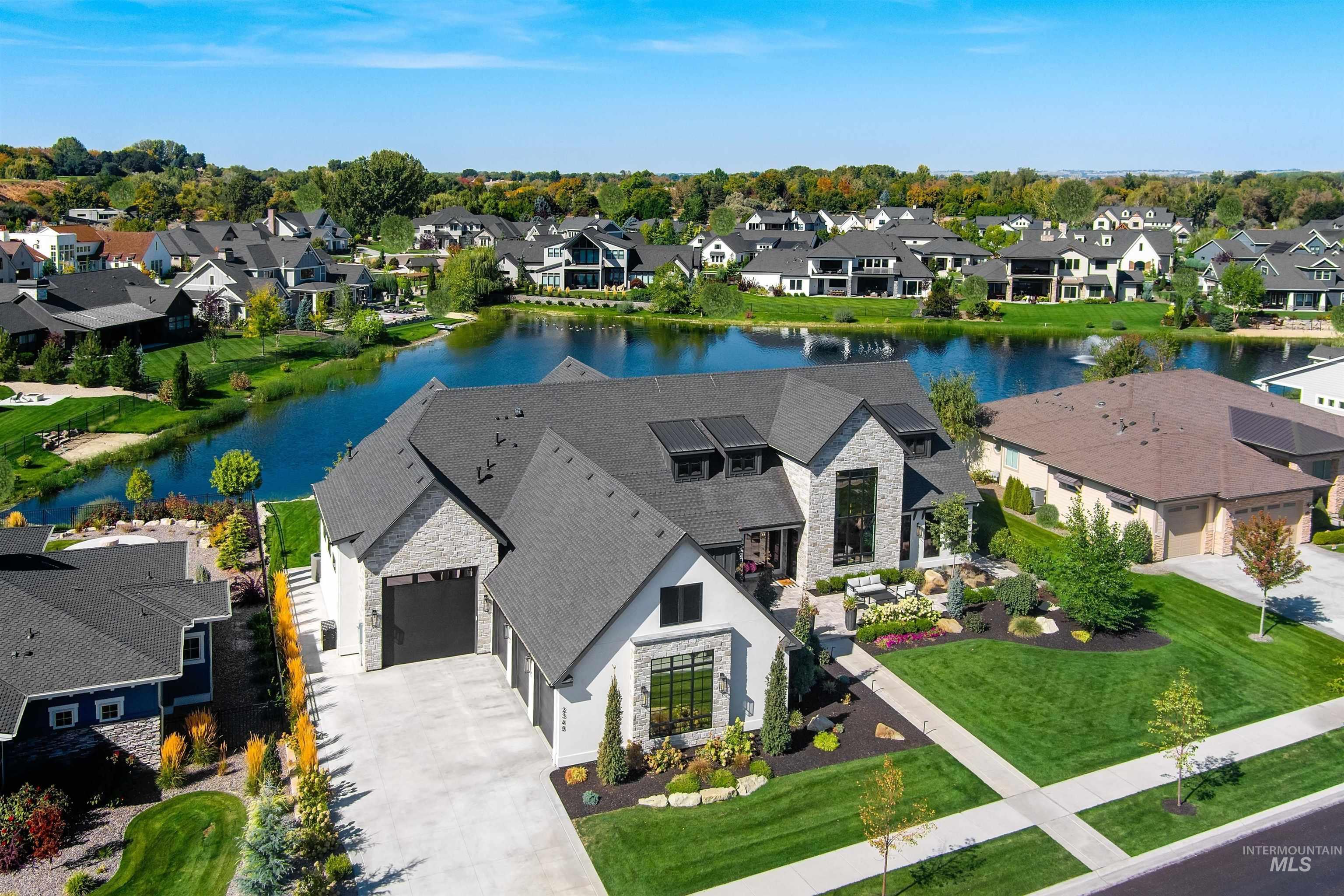 Aerial perspective of suburban area with a nearby body of water