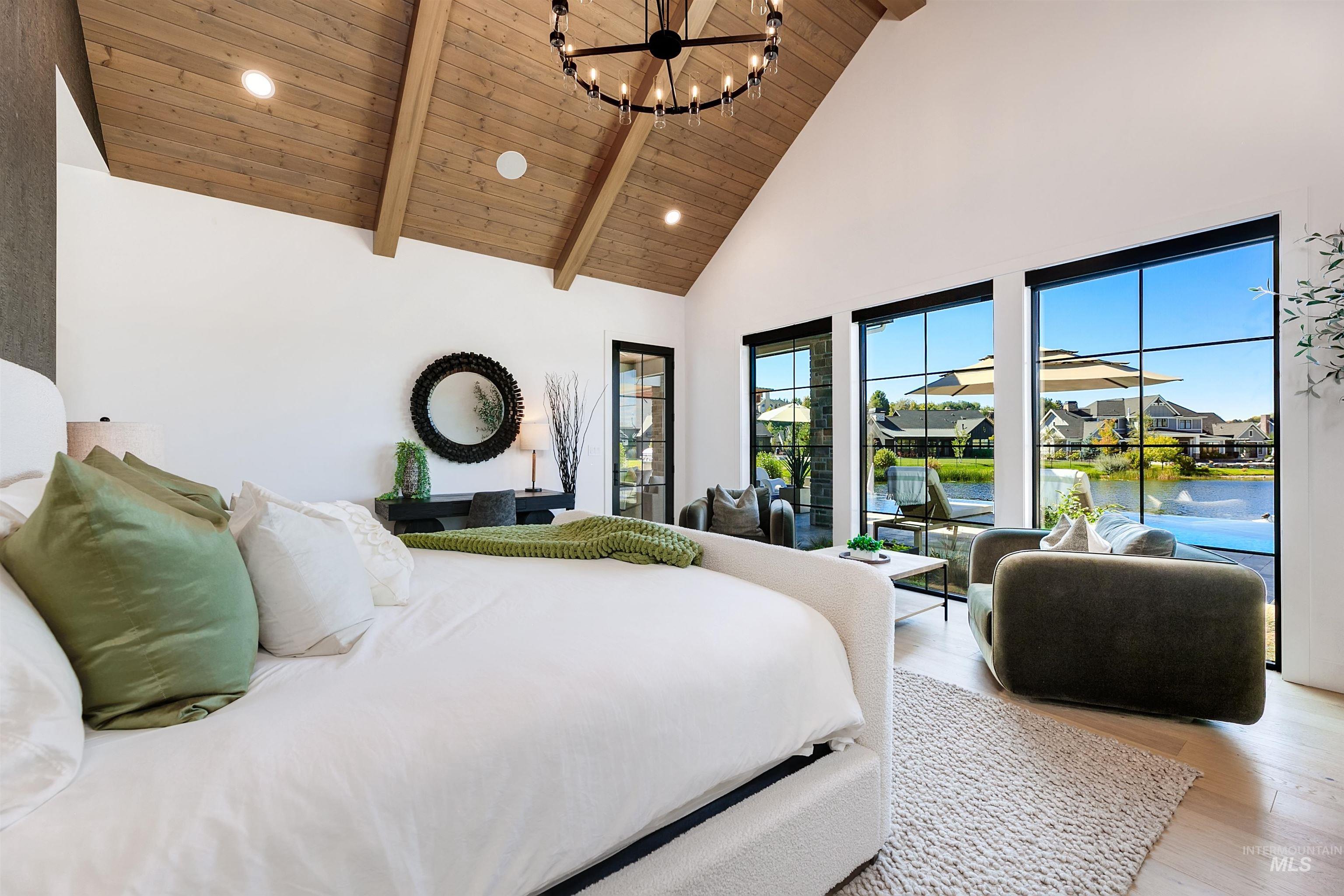 Bedroom with light wood-type flooring, high vaulted ceiling, a chandelier, recessed lighting, and a wooden ceiling with exposed beams