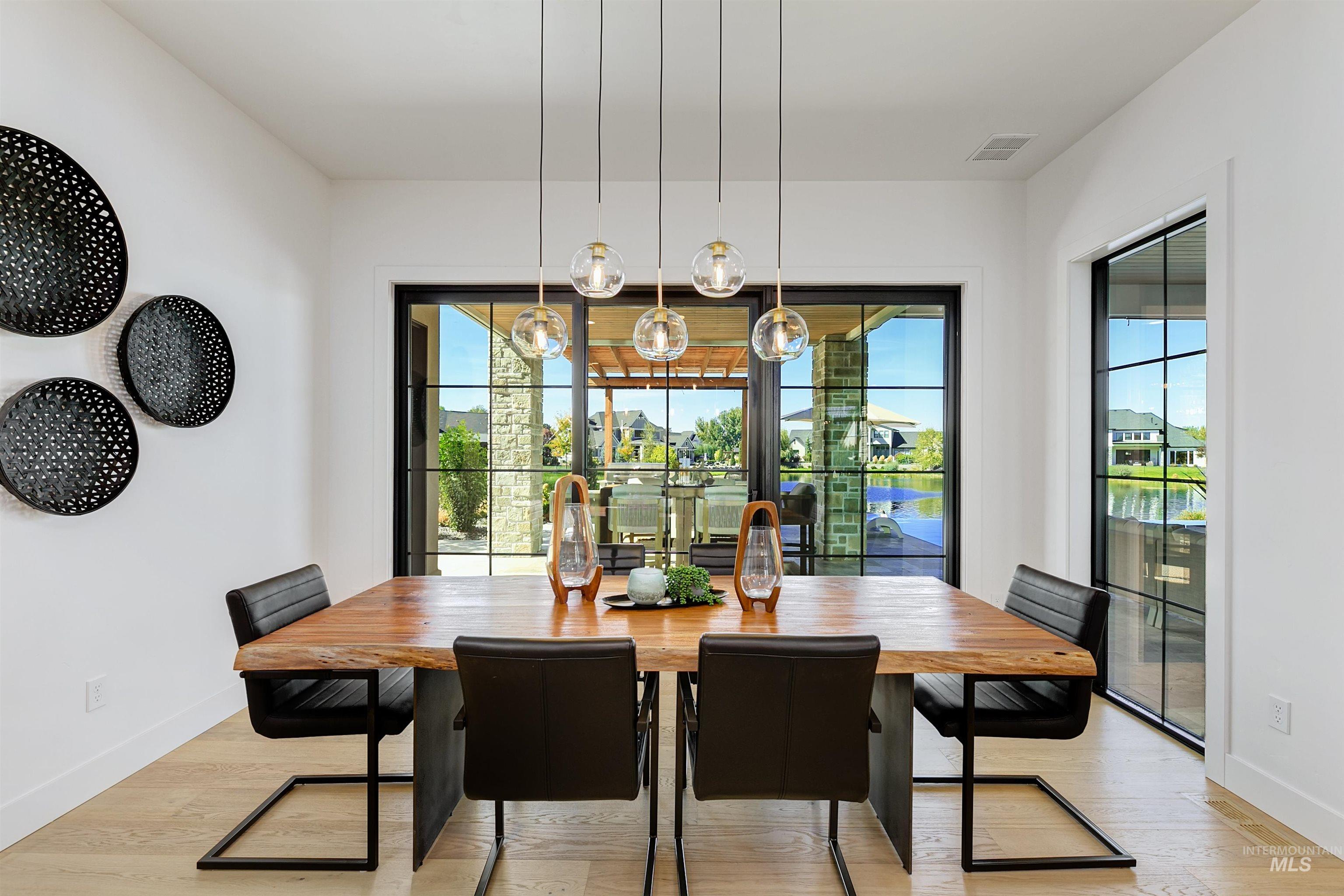 Dining room with baseboards and light wood finished floors