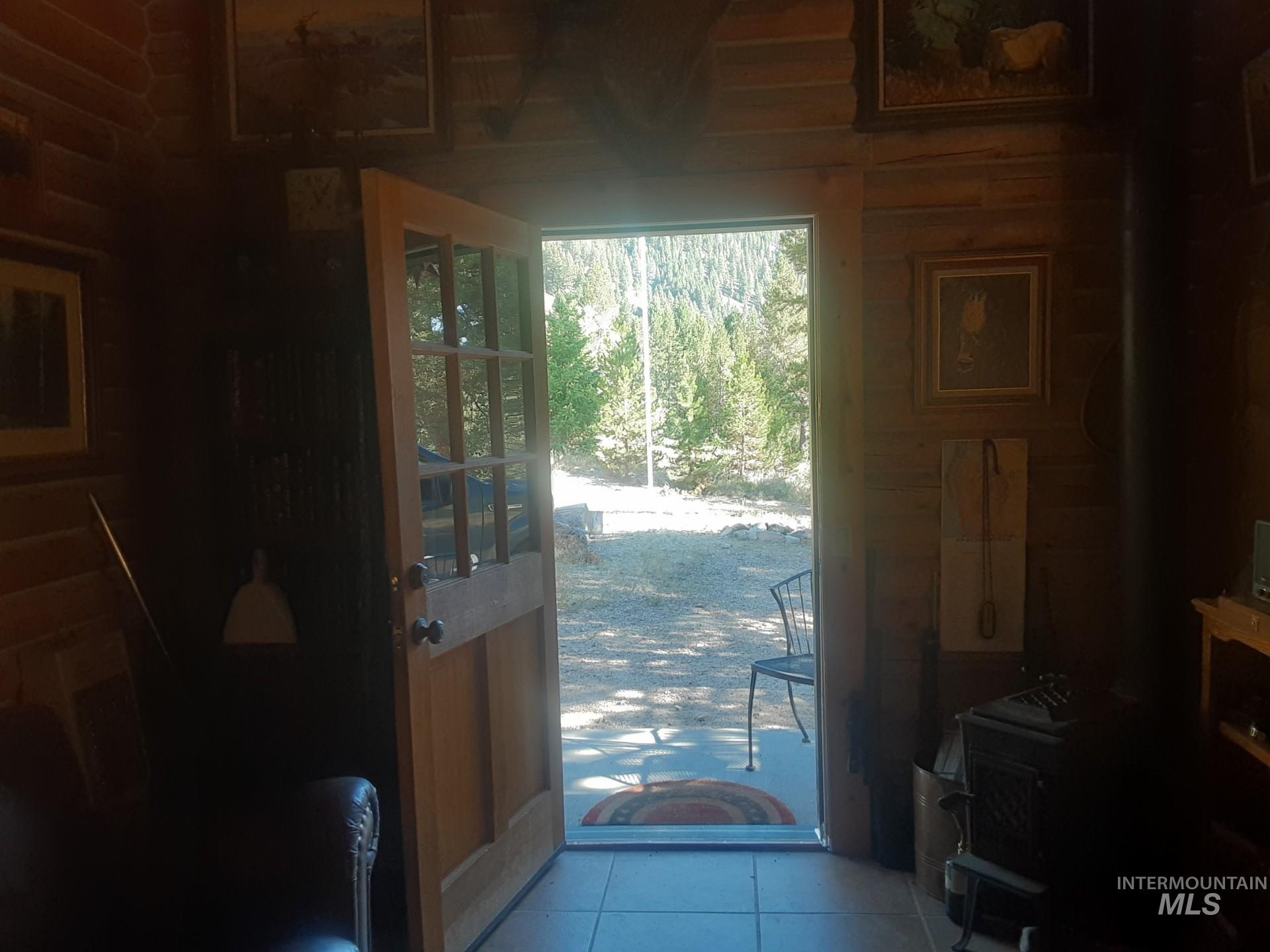 Doorway featuring tile patterned flooring